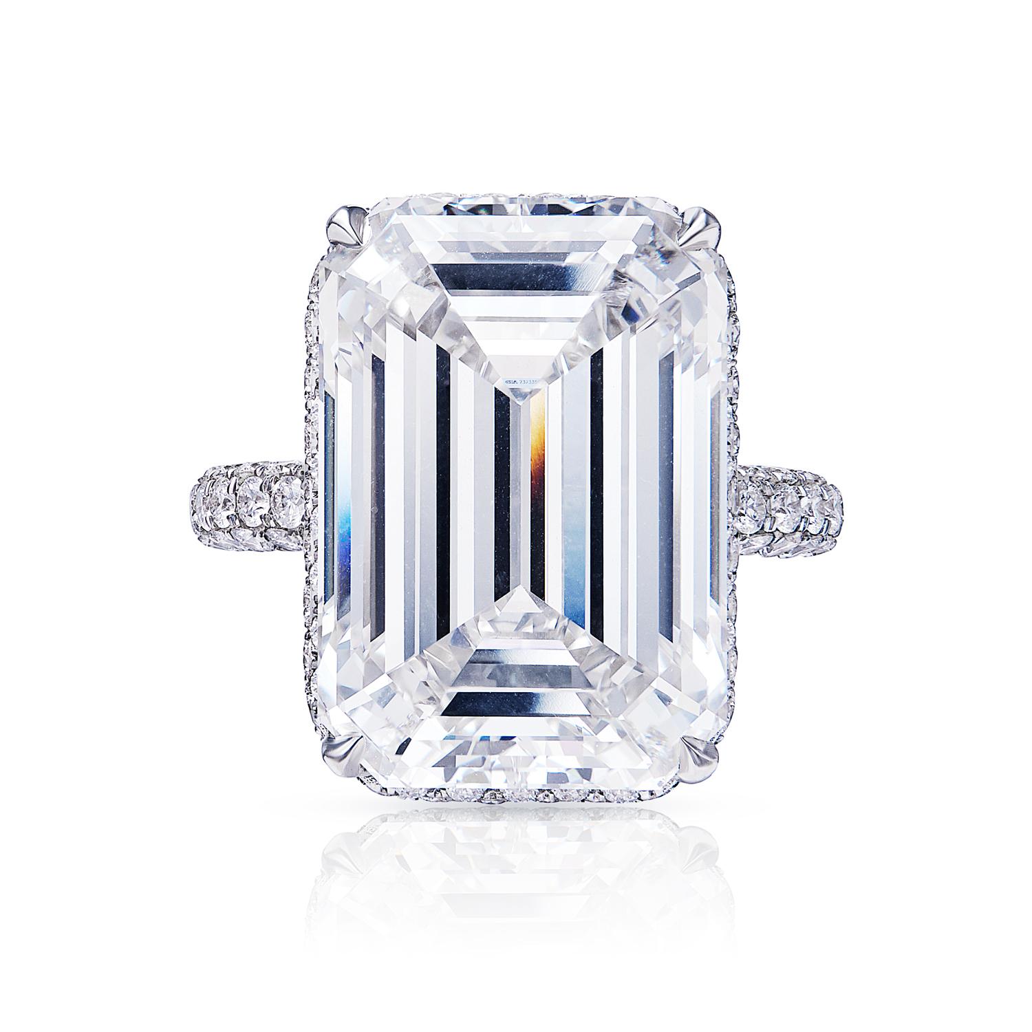 If you're looking for an emerald-cut diamond ring that is sure to impress, then look no further! This stunning ring features a beautiful emerald cut diamond that is prong set in a platinum band. The band itself is simple and elegant, allowing the