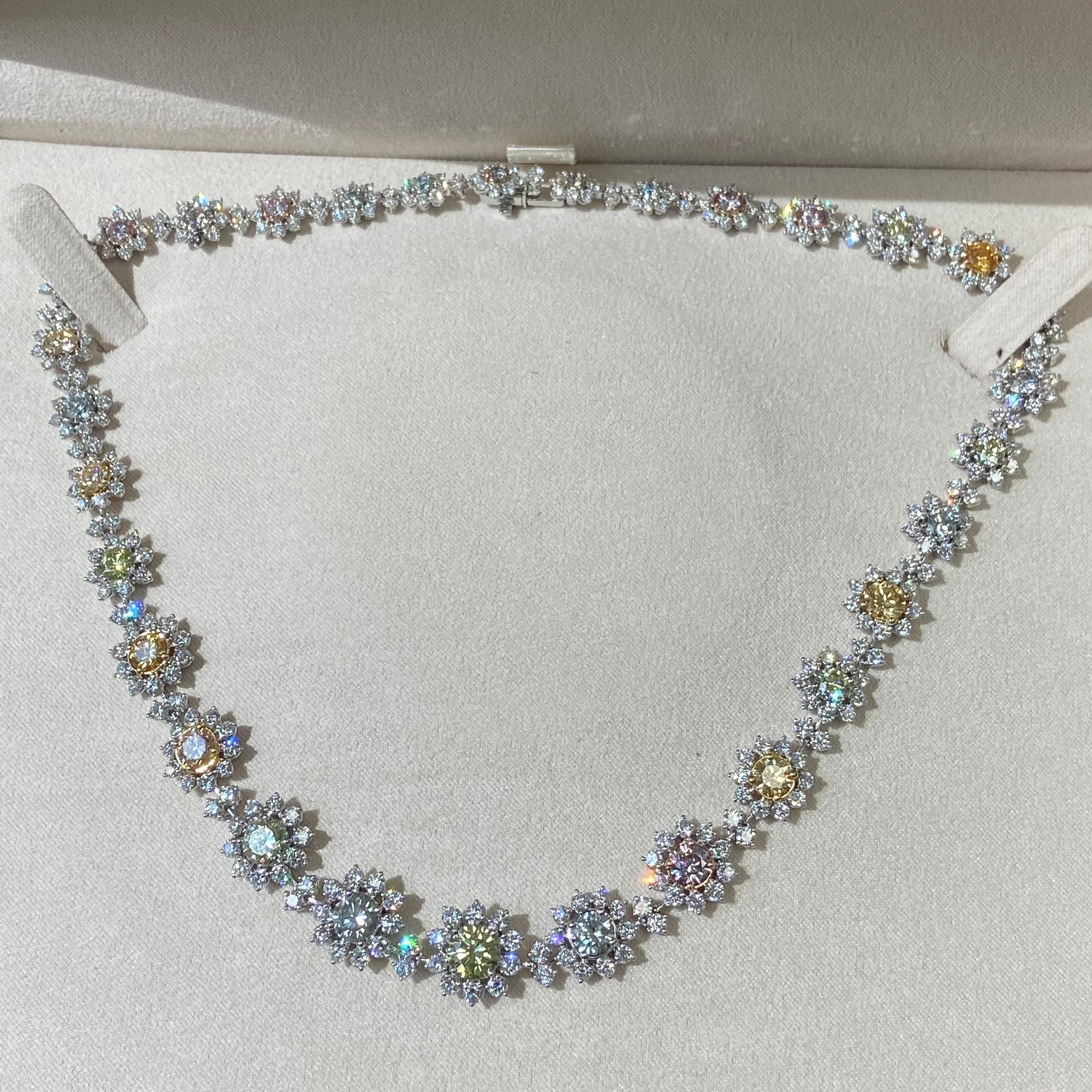 This breathtaking natural color diamond necklace is a true masterpiece, featuring 31 exquisite fancy color diamonds in shades of green, blue, pink, yellow, and orange.
A one of a kind necklace, that you will never come across again. Each GIA