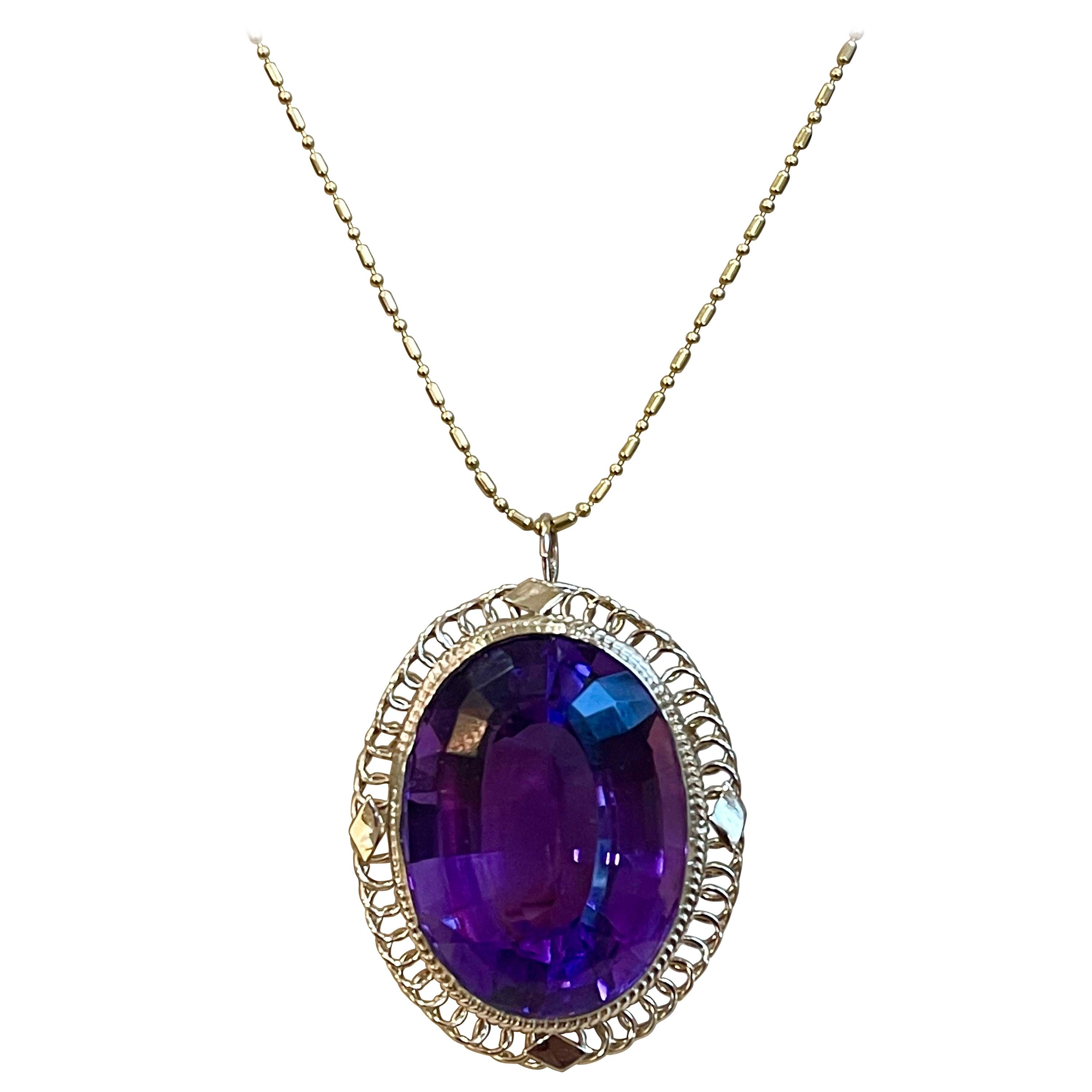  Approximately  23 Carat Amethyst Pendant  Chain Necklace  14 Karat Yellow Gold  Vintage

This spectacular Pendant Necklace  consisting of a single large Oval Cut Amethyst , approximately  23 Carat.  The  Amethyst   is surrounded by a intricate