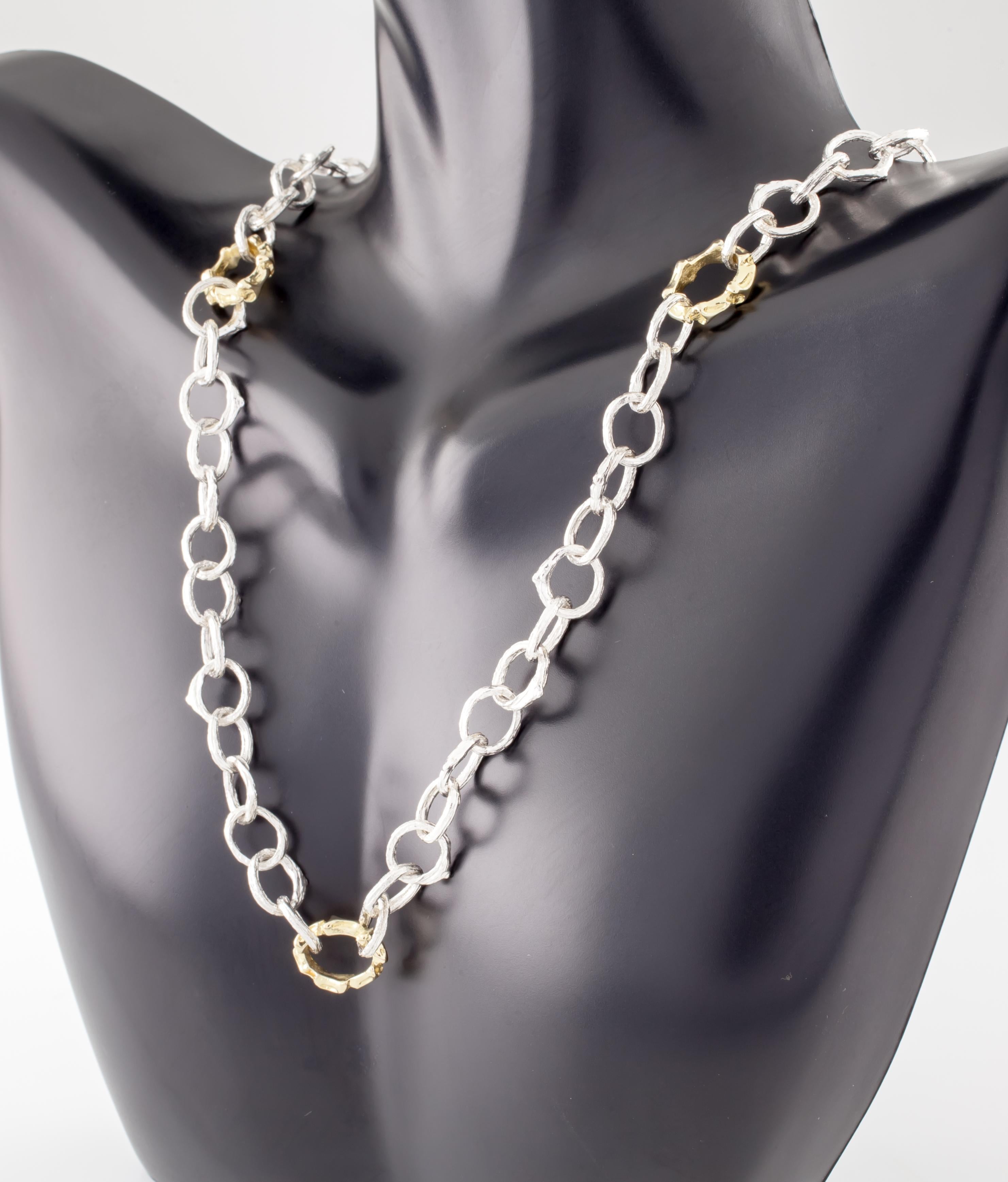 Gorgeous Sterling Silver and 18k Yellow Gold Necklace by Renowned Jeweler Katey Brunini
Feature Twig Designs in Interlinked Sterling Silver and 18k Gold Loops
Silver Loops Appx 9 mm in Diameter
Gold Loops Appx 12 mm in Diameter
Necklace = Appx 23