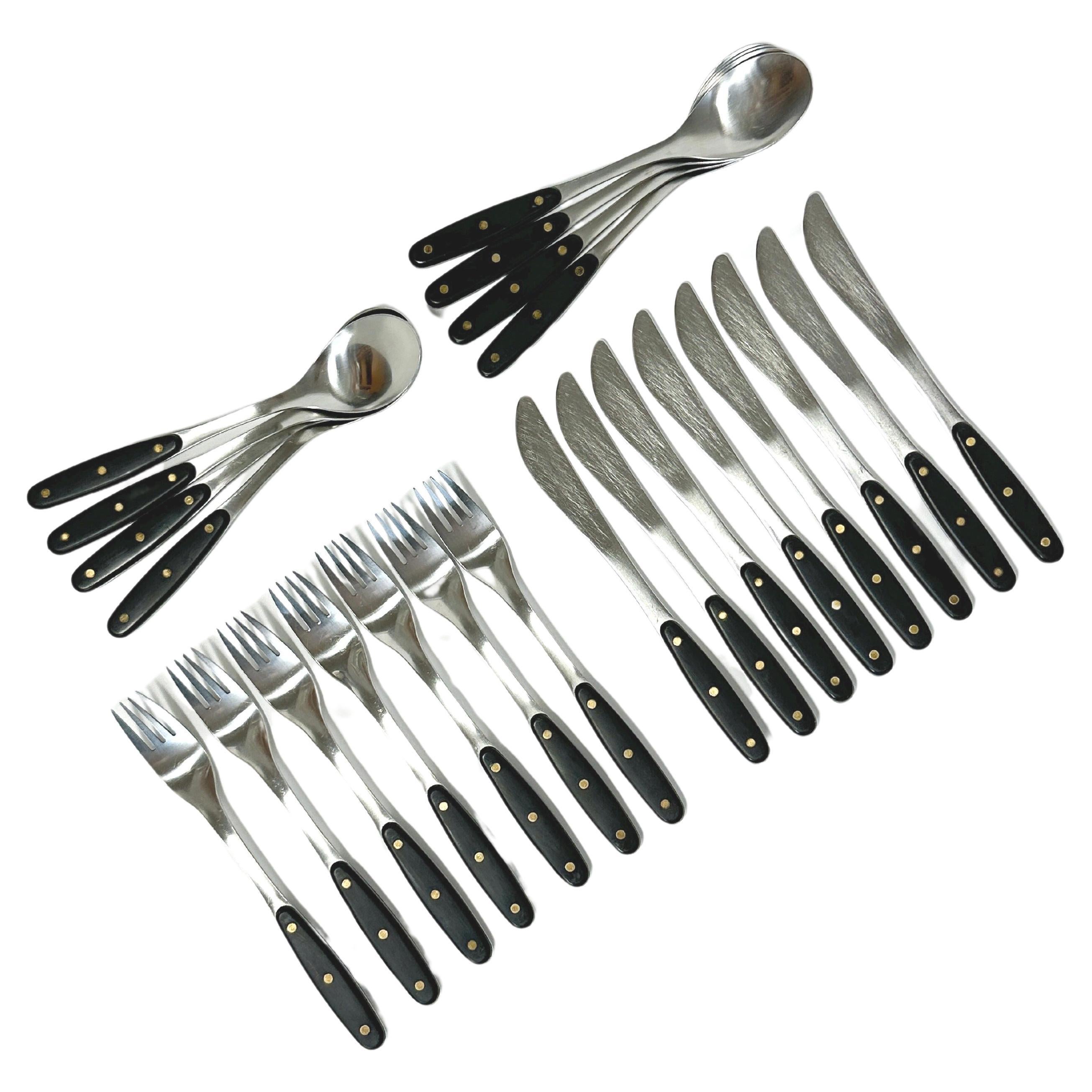 Set of 23 pcs ‚Kievari’ flatware designed by Adolf Babel for Hackman, Finland, in the 1970s.

Stainless steel with brushed plastic handles with brass studs.

Length: 18.9 cm - 19.6 cm

