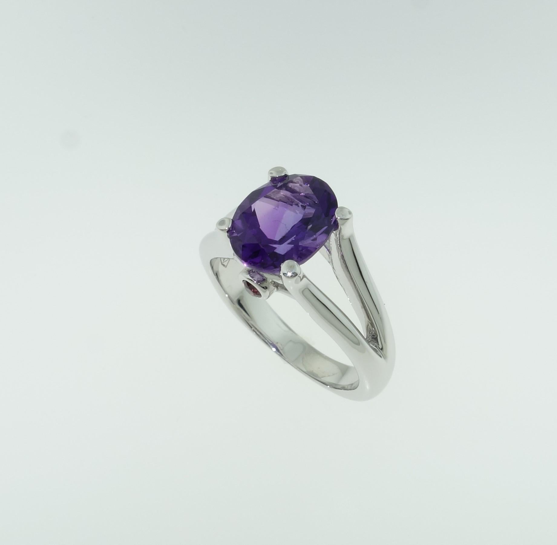 Beautiful ring featuring a 2.30 Carat oval Amethyst in center enhanced with Sapphires; approx. .07tctw; Sterling Silver Tarnish-resistant Rhodium mounting; Size 7, we offer ring re-sizing; Stylish and Classy…illuminating your look with Timeless
