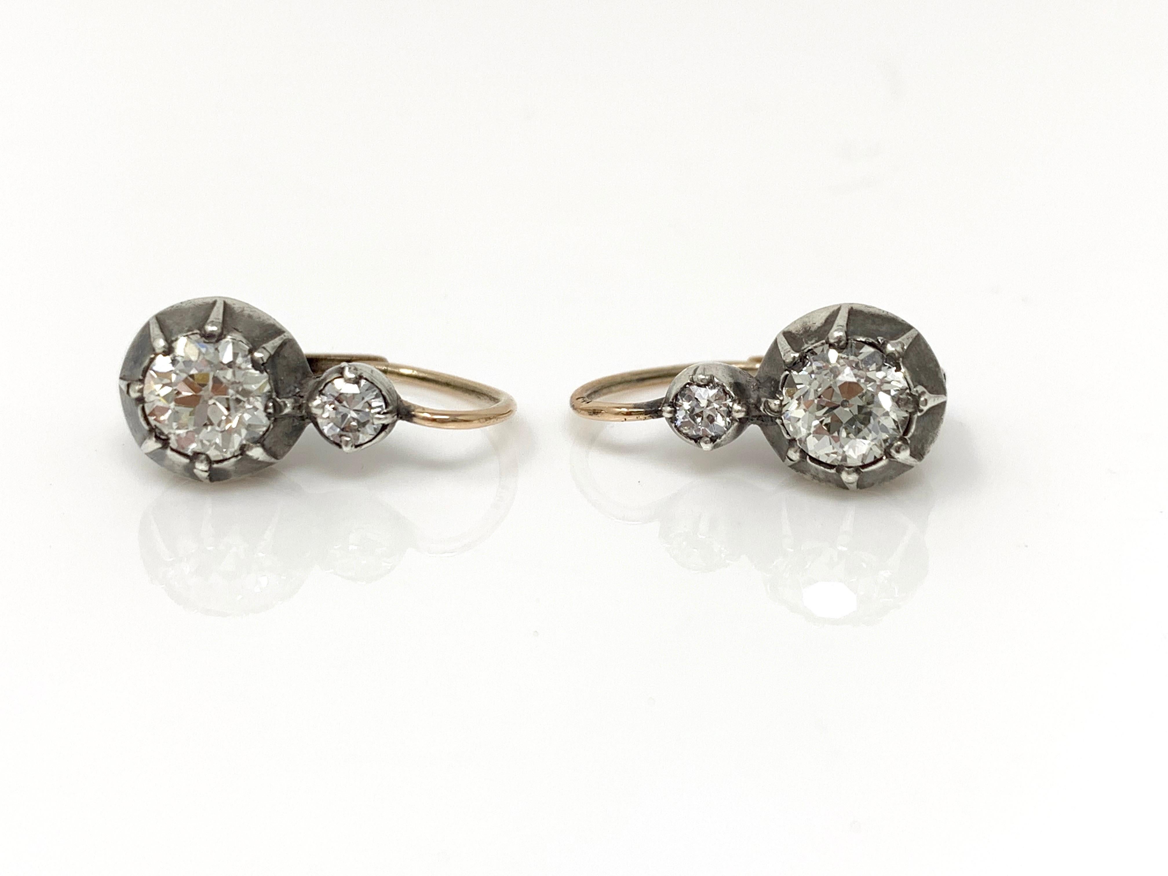 These absolutely gorgeous earrings are handcrafted and antique. 
Old European cut diamond weight (4) - 2.30 carat ( HI color and VS clarity ) 
Measurements : 0.75 inches long 
These are light weight and perfect for daytime or evening wear.