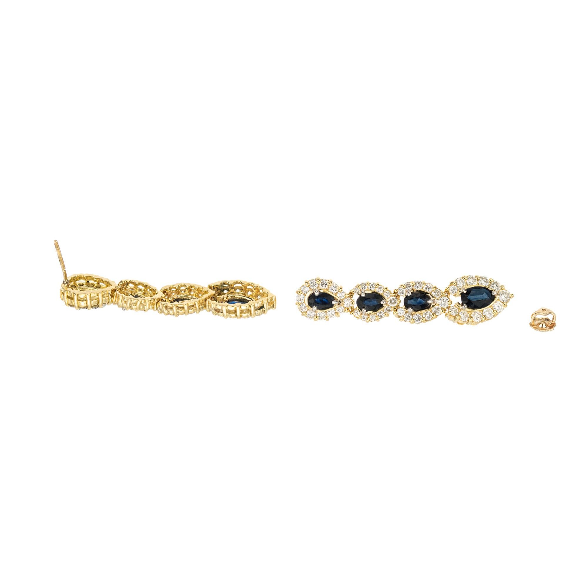 Taglio ovale Orecchini a pendente in oro giallo con diamante e zaffiro blu ovale da 2,30 carati in vendita