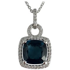 2.30 Carat Blue Topaz and Diamond Halo Pendant in 14 Karat White Gold 2.30 Carat Blue Topaz and Diamond Halo Pendant in 14 Karat White Gold
