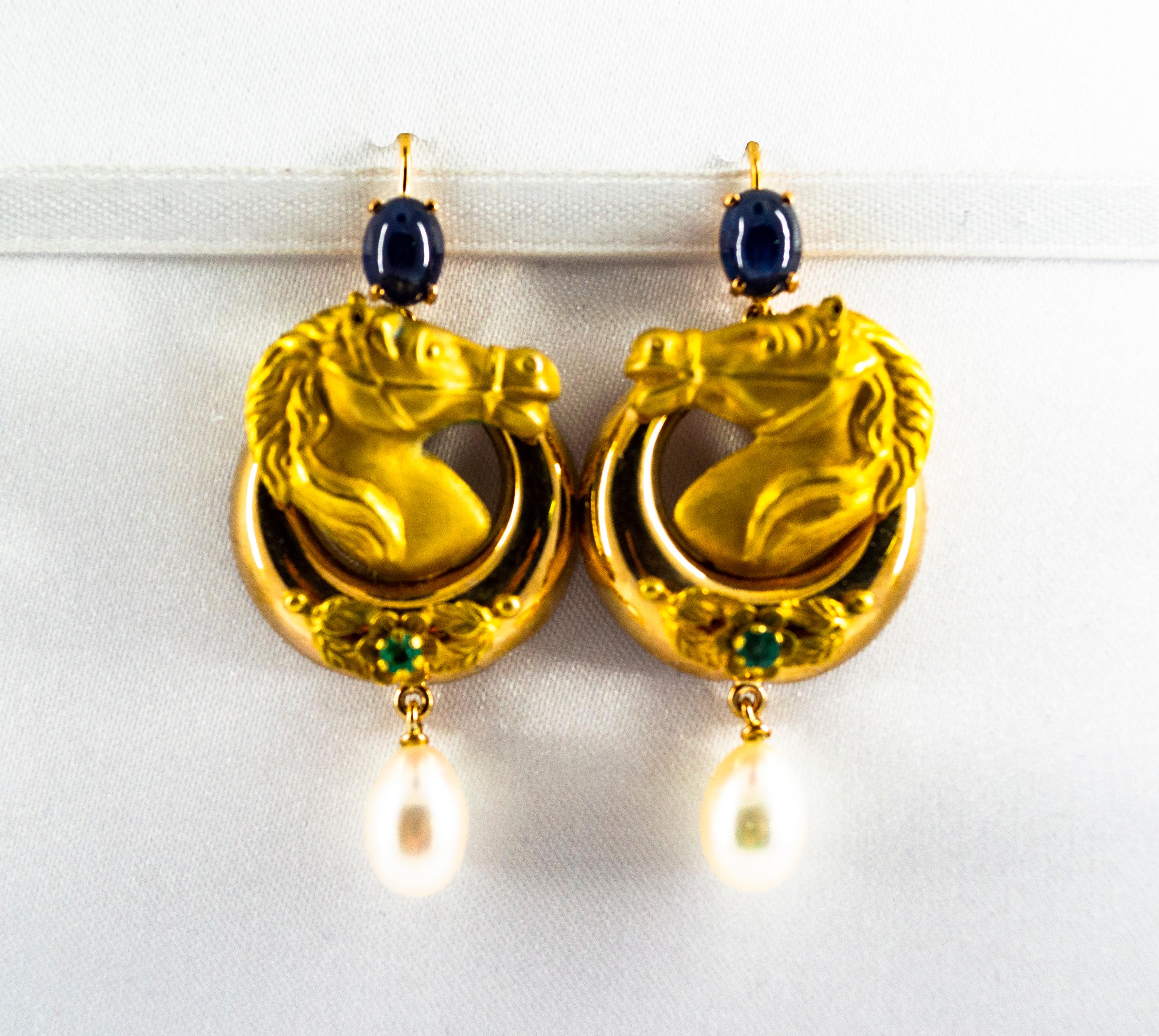 These Earrings are made of 14K Yellow Gold.
These Earrings have 2.30 Carats of Blue Sapphires and Emeralds.
These Earrings have two Pearls.
All our Earrings have pins for pierced ears but we can change the closure and make any of our Earrings