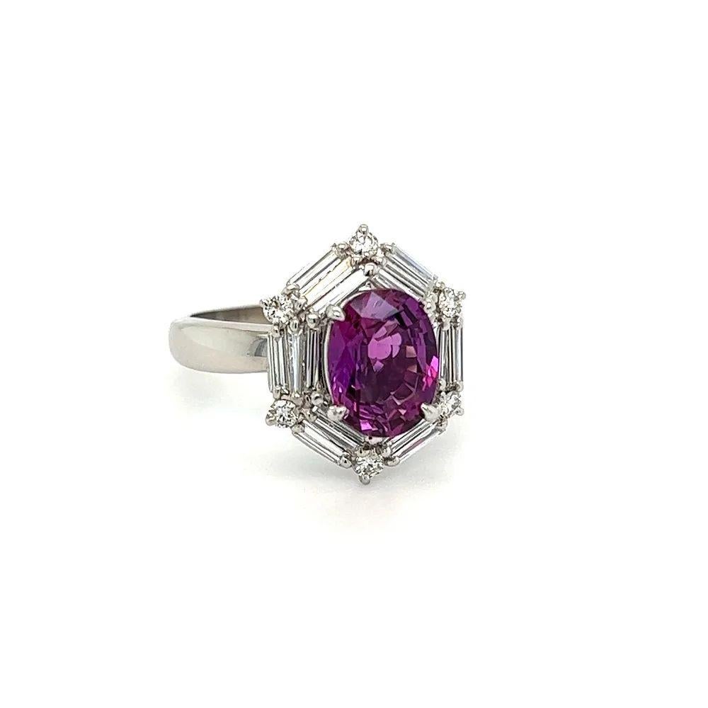 Simply Beautiful! Finely detailed GIA Purple Sapphire and Diamond Platinum Ring. Centering a securely nestled Oval Purple Sapphire, weighing approx. 2.30 Carats surrounded by Baguette & Round Diamonds, weighing approx. 0.64tcw. Hand crafted Platinum