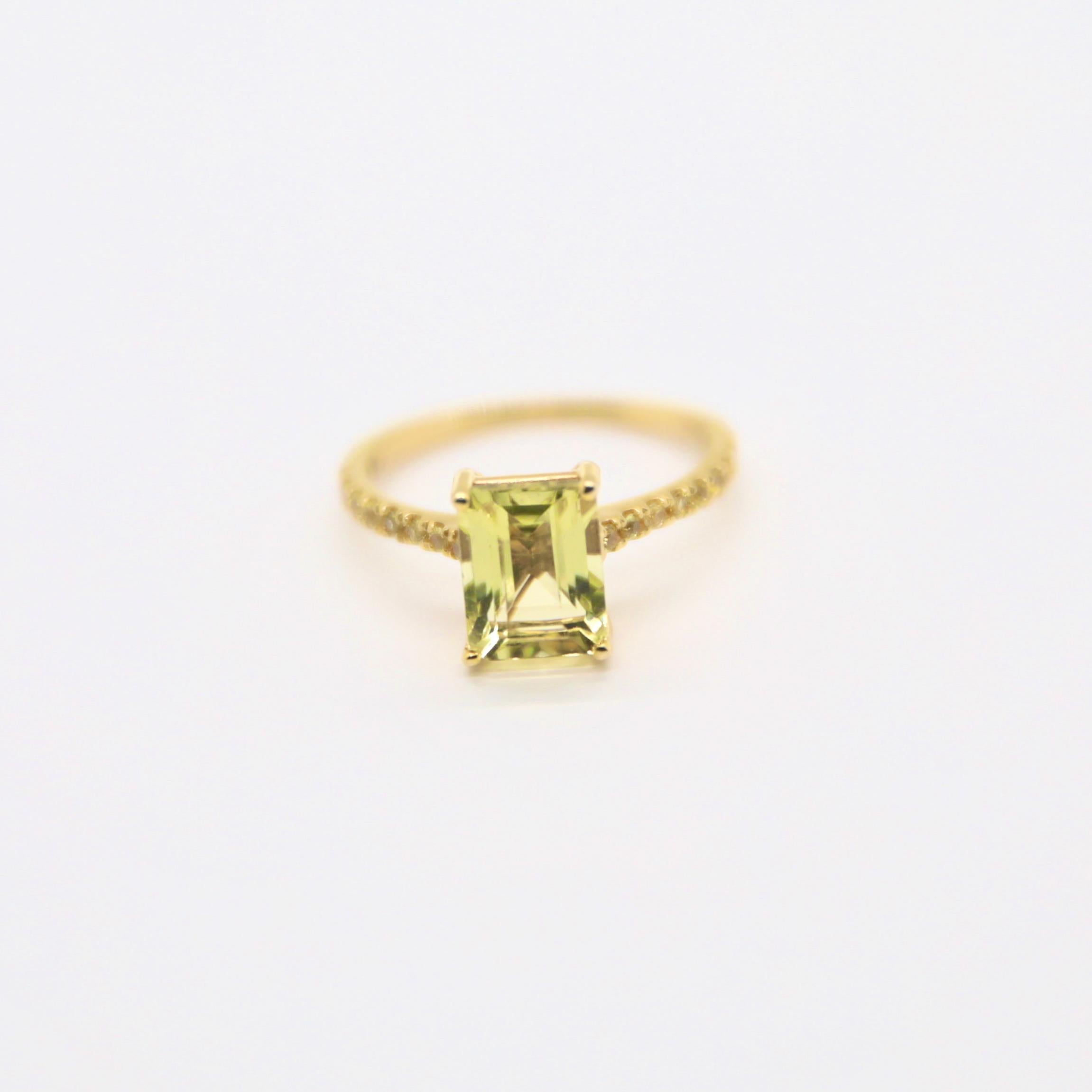 PRODUCT DETAILS

- Emerald cut lemon quartz - 9 X 7 mm,  2.30 carat total weight

- Round Yellow sapphire on the shank : 0.15 ct. t.w

- 14k yellow gold (stamped)

- Almost all gemstones have been treated to enhance their beauty 

- Finger size: 