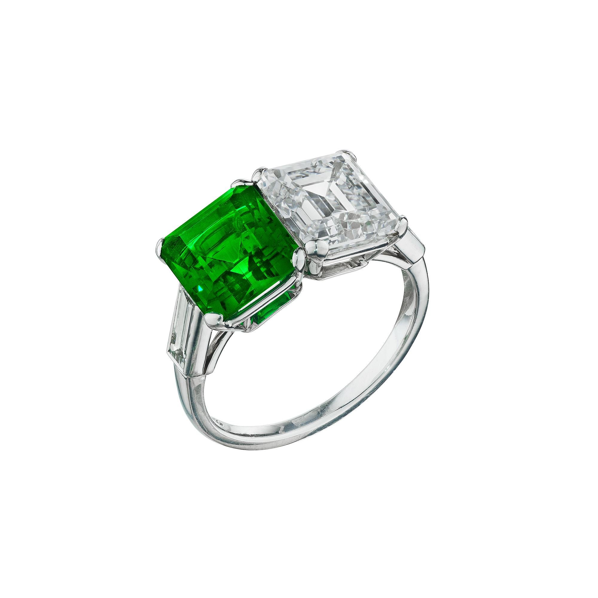 Double your pleasure with this extraordinary natural Columbian emerald and diamond two-stone handmade platinum ring. With a 2.30 carat luscious emerald cut emerald and a 2.82 emerald cut white diamond, designed as a perfect marriage, this rare