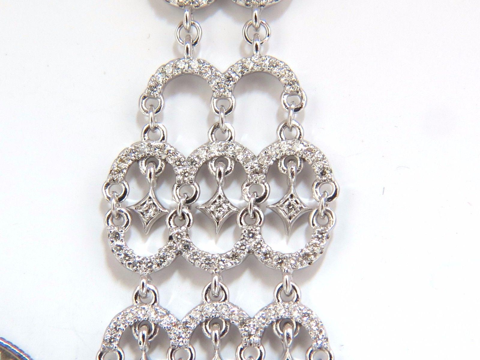 Long hinged loop diamond dangle earrings.

2.30cts of natural round diamonds: 

G-color, Vs-2  clarity.

14kt. white gold

18.5 grams.

Earrings measure: 4.25 Inch Length

.81 inch diameter

Comfortable Omega closure

$8,000 Appraisal Certificate to