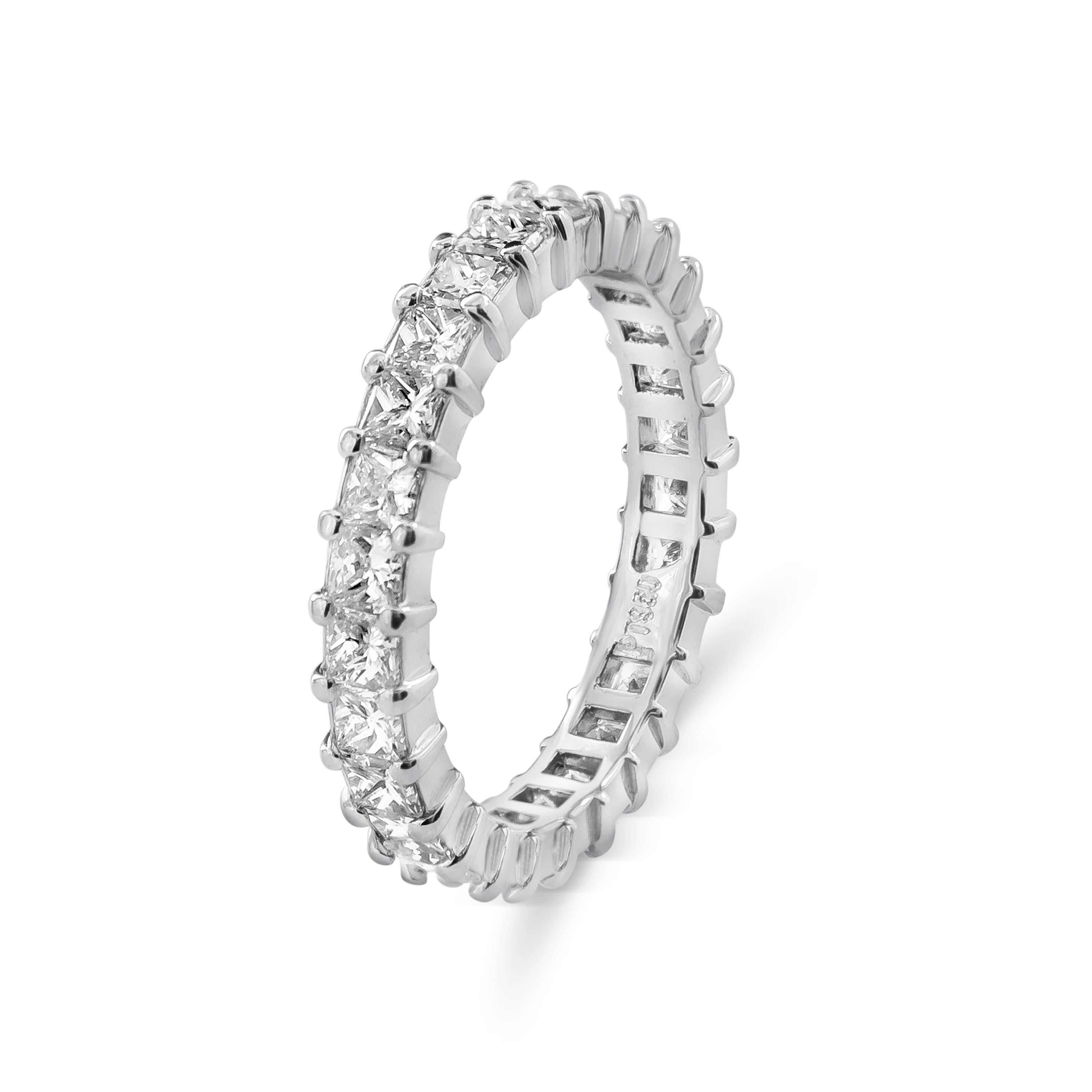 A magnificent eternity wedding band showcasing brilliant princess cut diamonds aligned in a basket prong setting. Diamonds weigh 2.30 carats total, F Color and VS in Clarity. Made with Platinum. Size 6.5 US resizable upon request.

Style available