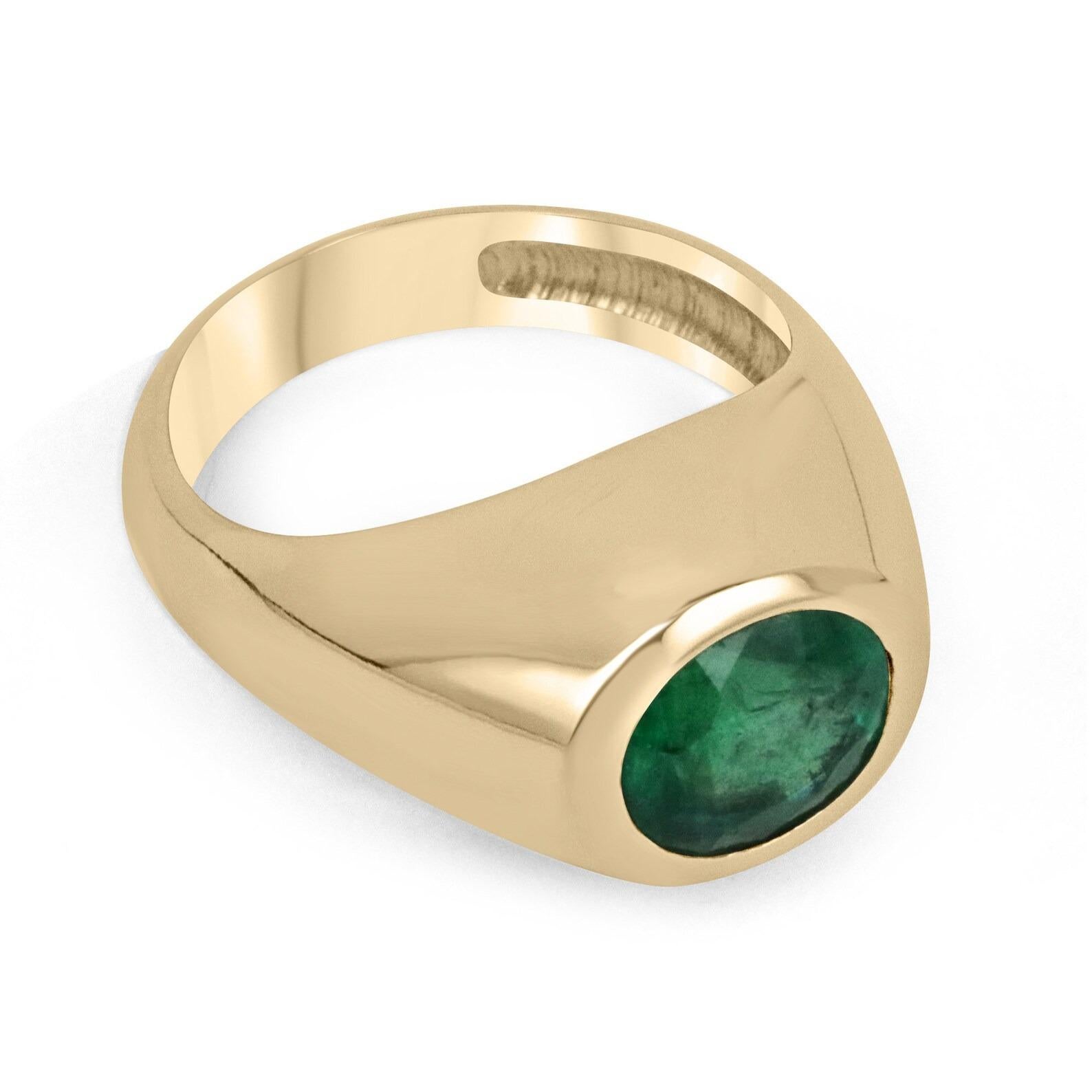 This is an elegant masculine oval emerald men's pinky ring that is sure to impress. A rare earth-mined natural emerald gemstone is securely bezel set. The ring is dexterously crafted in pure 18K solid yellow gold. A masterpiece meant to style for