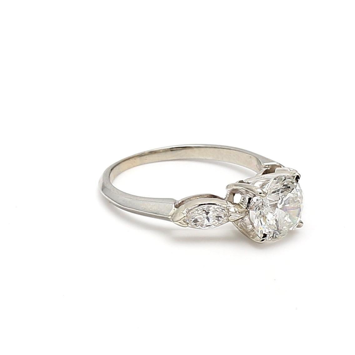 Title:
2.30 Carat Round Brilliant H I1 and Marquis Shape H SI1 Diamond Platinum Engagement Ring


Style:
Engagement


Metal:
Platinum


Gemstone 1:
2 Carat Diamond


Number of Stones:
1


Color:
H


Clarity:
I1


Shape:
Round Brilliant


GIA:
DIAM