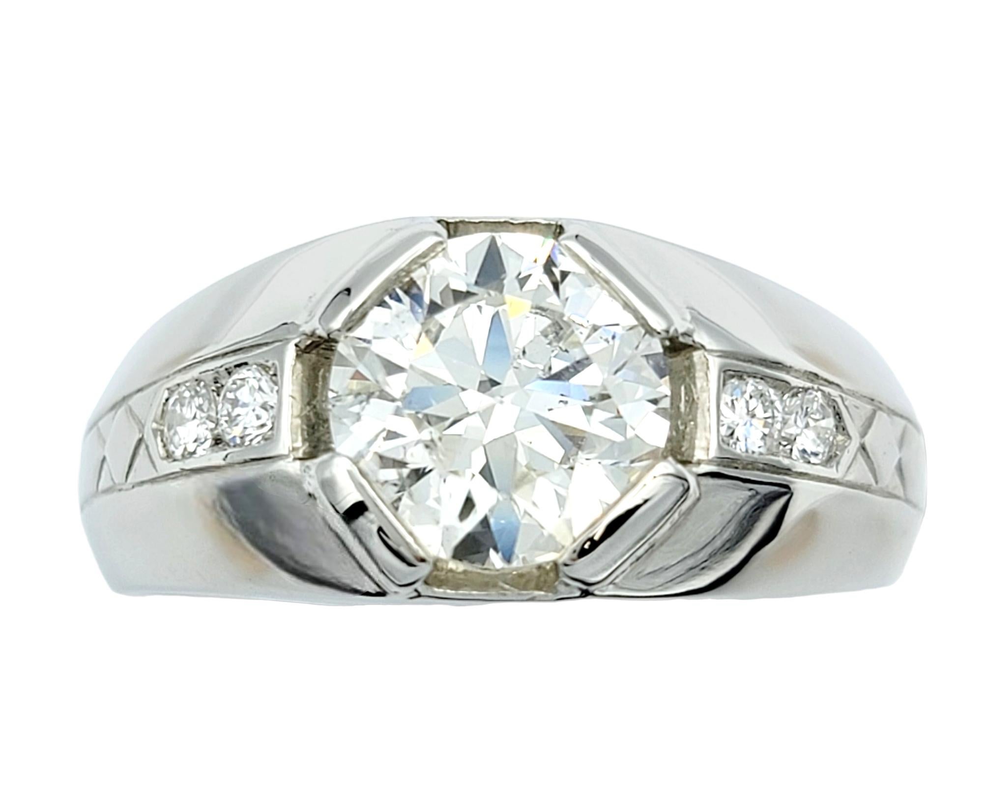 Ring size: 9.75

This brilliant 1960's platinum signet men's ring is a masterpiece of elegance and refinement, designed to make a bold statement. At its heart, an exquisite 2.15 carat early modern brilliant cut diamond captures the eye, held