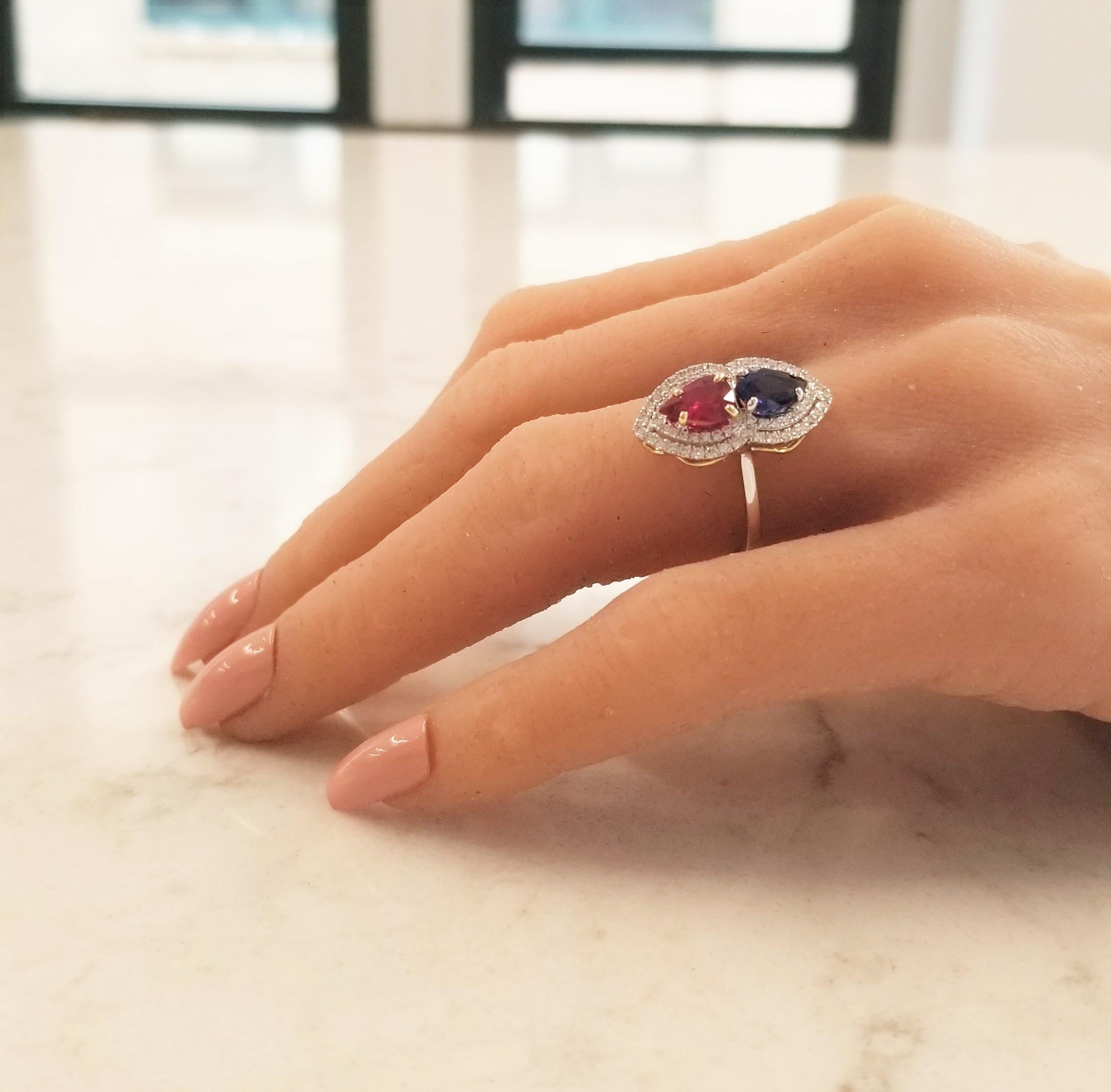 If you want an unparalleled design with top-end precious gems, consider this ring. An important unheated GIA certified 1.05 carat, pear-shaped, blood red ruby is from Mozambique. Its color is vibrant; its transparency and luster are superb. Sharing