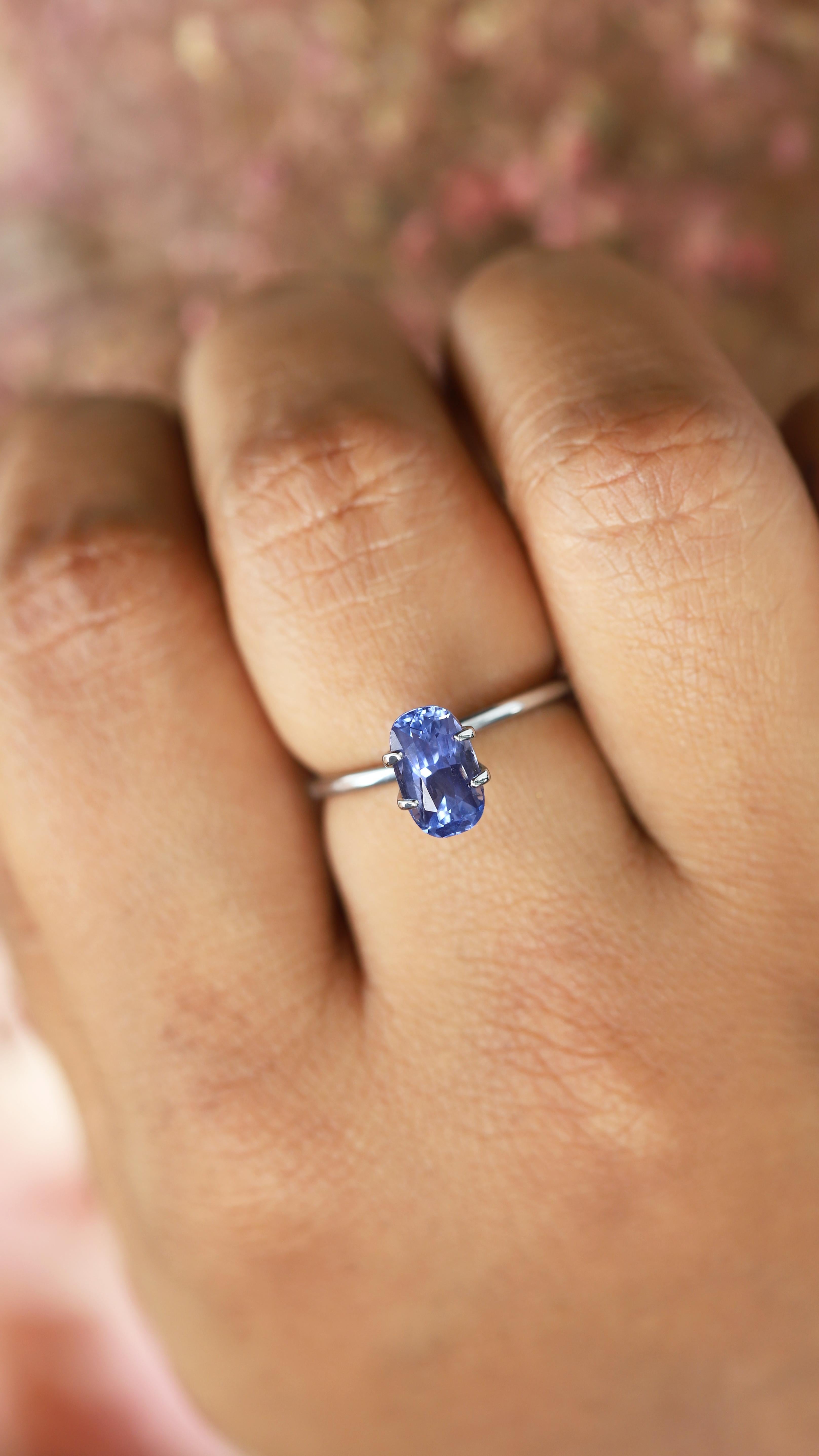 An exquisite unheated, natural sapphire gracefully dancing in light like a cosmic ballerina whilst showcasing her heavenly cornflower hues. Shaped into the form of a long cushion with scissor-cut facets that shower a cascade of brilliant sparkles,