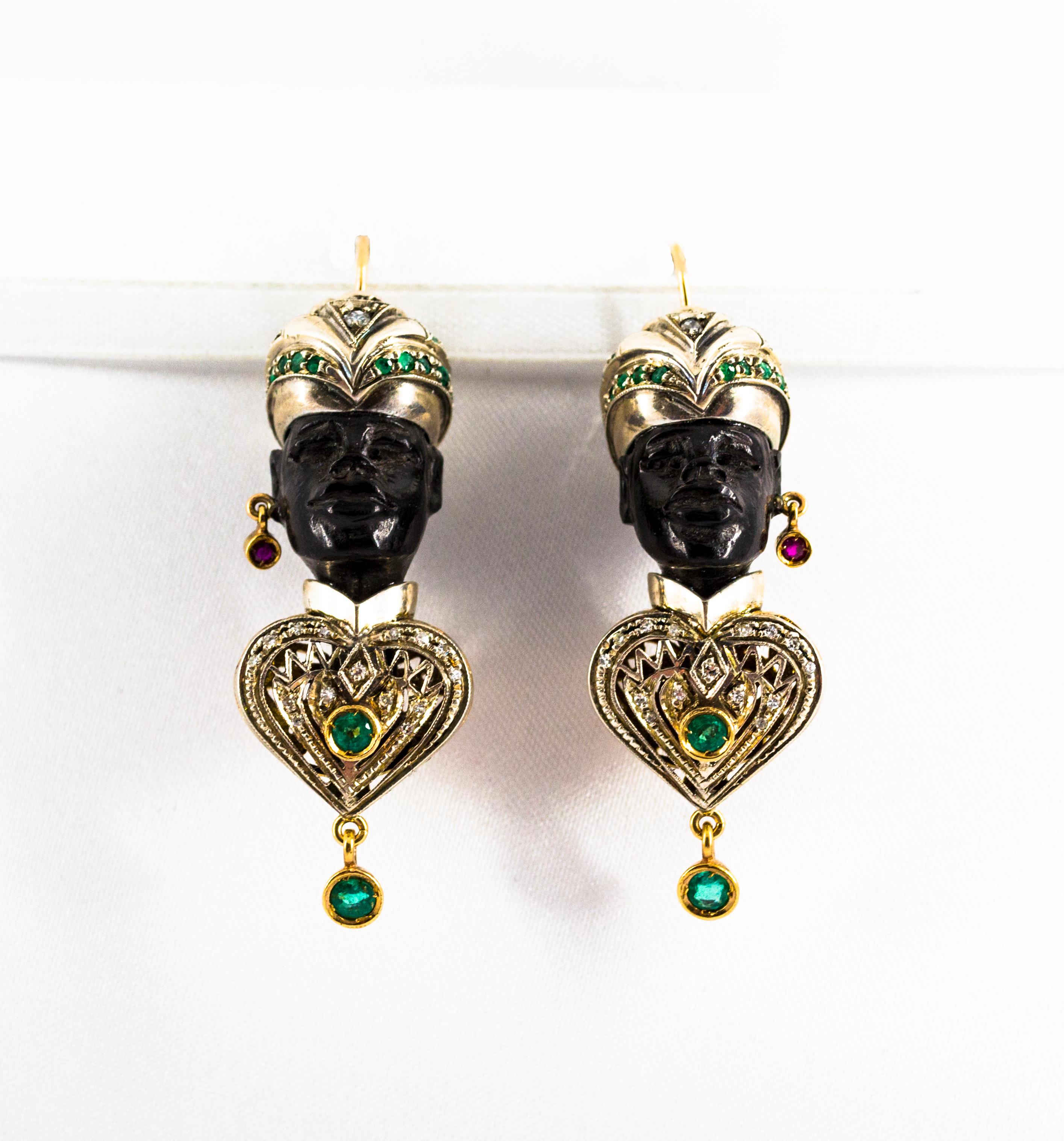 These Earrings are made of 9K Yellow Gold and Sterling Silver.
These Earrings have 0.20 Carats of White Diamonds.
These Earrings have 2.00 Carats of Emeralds.
These Earrings have 0.10 Carats of Rubies.
These Earrings have also Ebony.
We're a