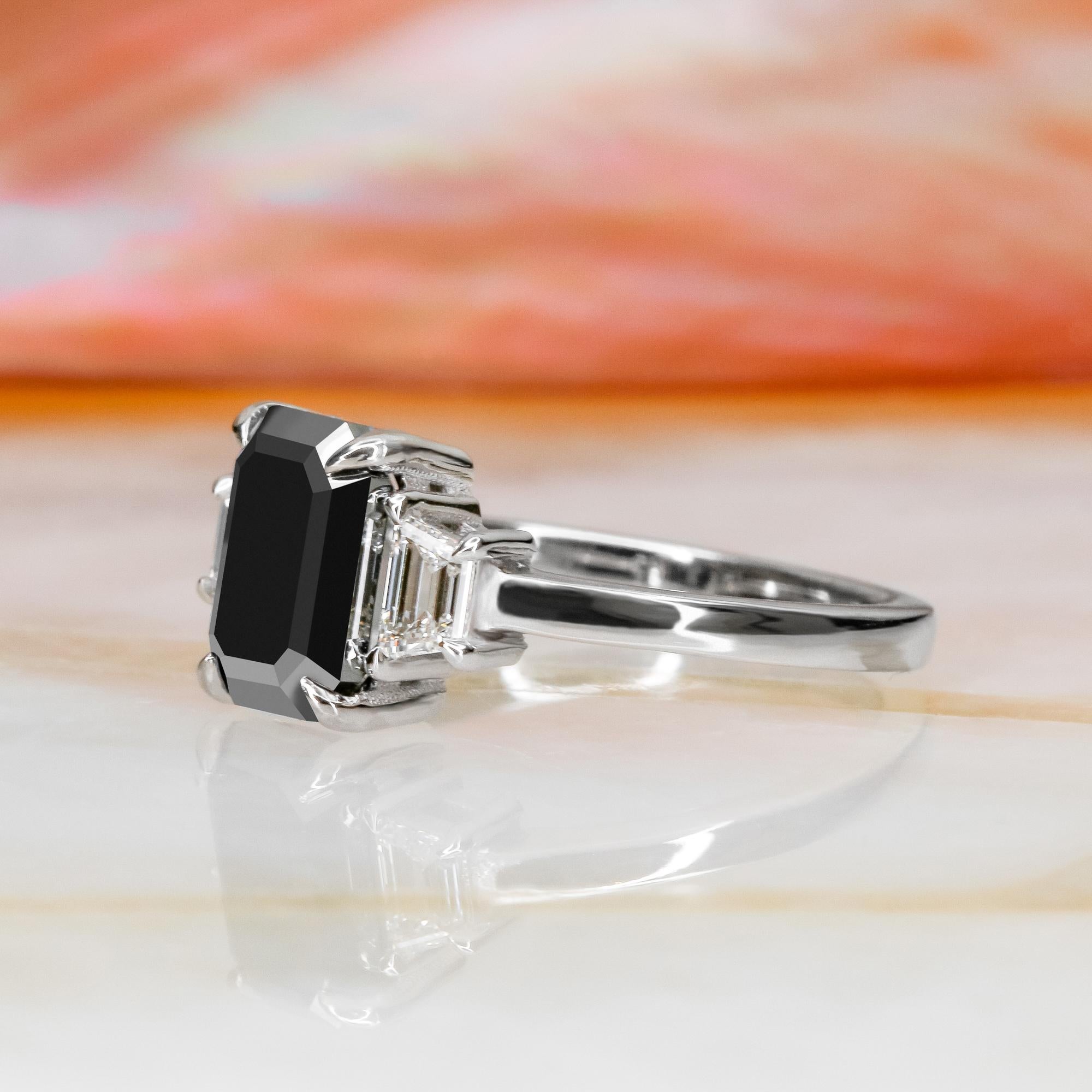 Art Deco 2.30 Carats Black Emerald Cut & White Trapezoids Engagement Ring in White Gold For Sale