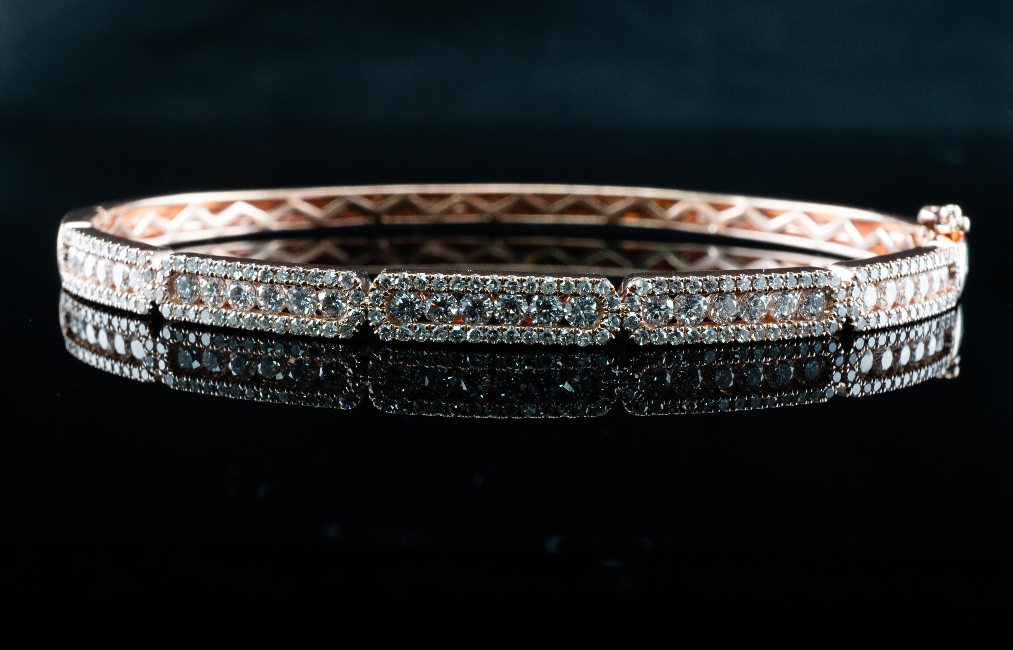 This lovely estate bracelet is finely crafted in solid 14K Rose Gold.
There are 180 white and fiery diamonds in this bangle.
The diamonds are VVS2 clarity and G color = 2.30 carats.
The bracelet's circumference is 2 1/4