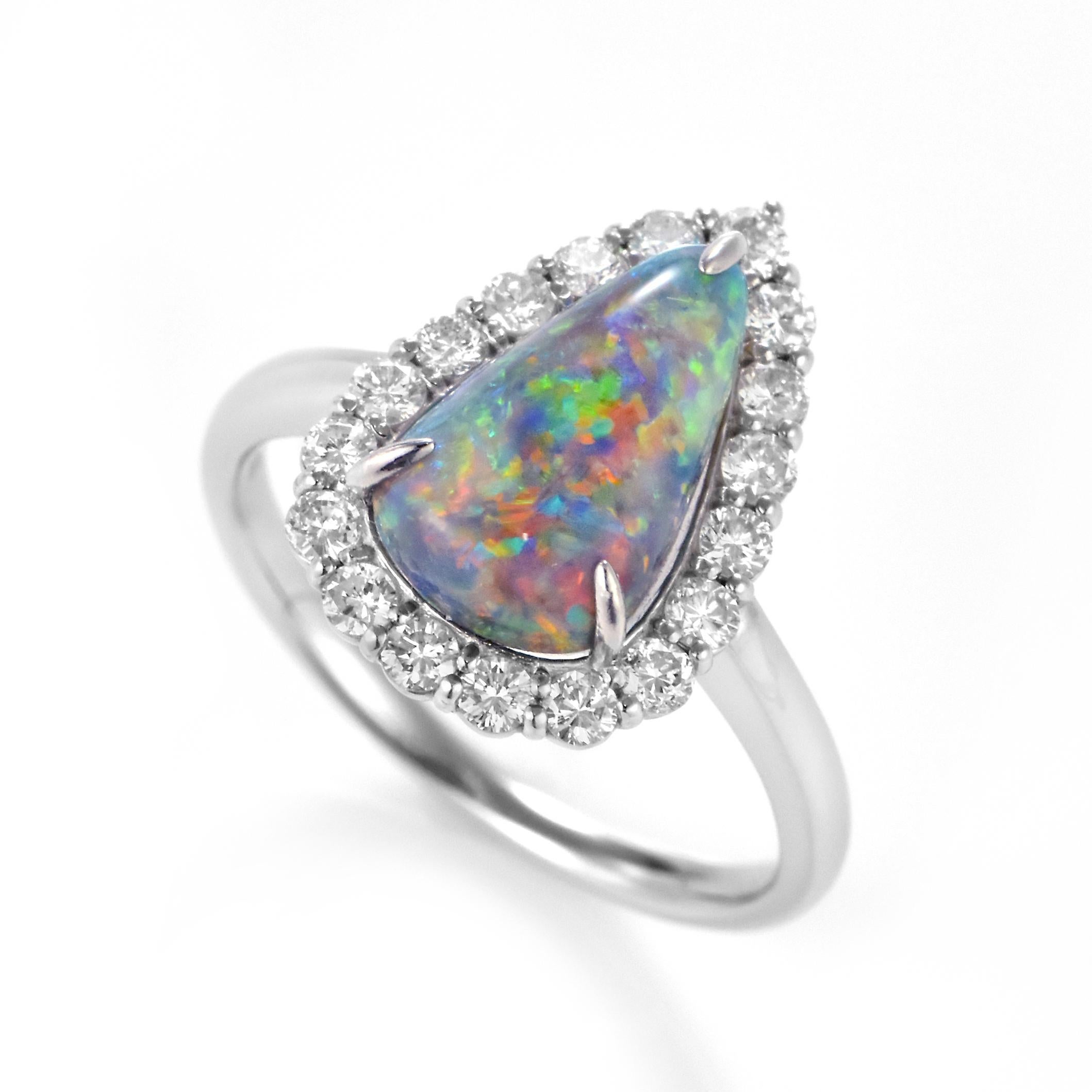 A beautiful ring featuring a 2.302 Carat Australian Black Opal and 0.53 Carat Diamonds made in Platinum. The Opal displays very good play of color! Opals are known for exhibiting flashes of rainbow colors known as 