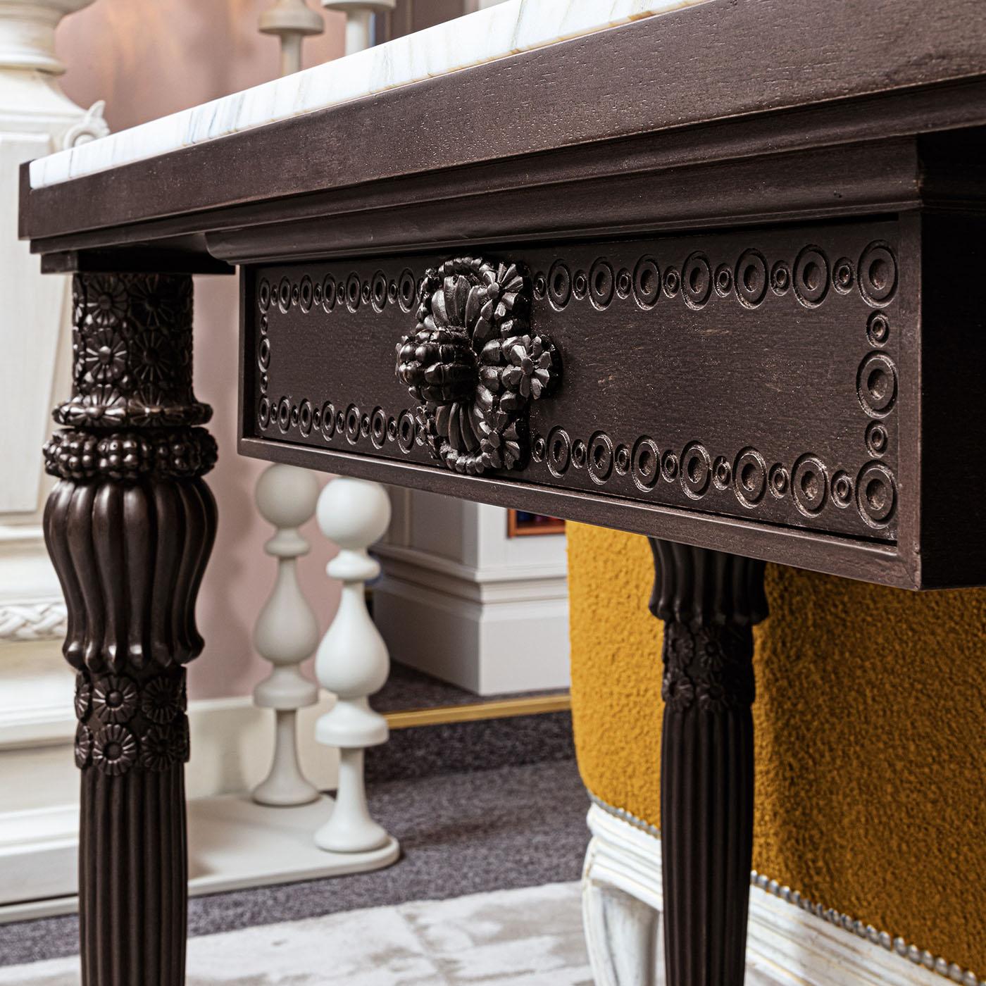 Hand-carved console with a solid wooden frame. The inlaid top is adorned with fine marble and mother-of-pearl inlays. This reinterpretation of an original deco piece makes this console timeless.