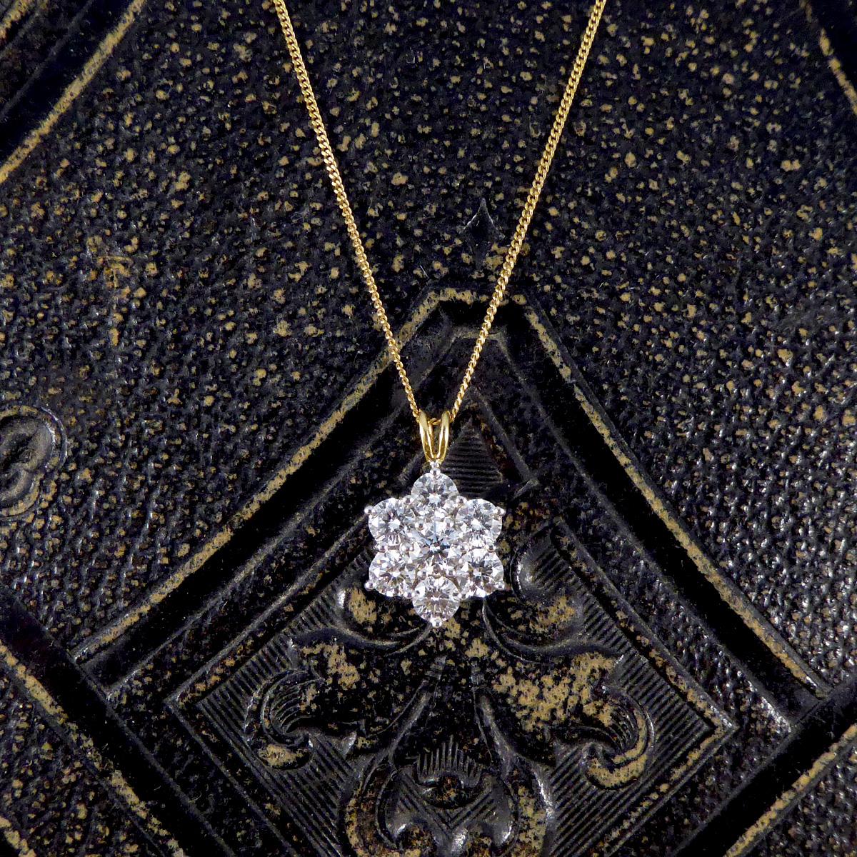 Unveil the elegance of our 2.30ct Diamond Daisy cluster pendant necklace. At the heart of this pendant lies a cluster of seven brilliant cut diamonds, totaling 2.30ct, each meticulously chosen for their exceptional sparkle and clarity. These