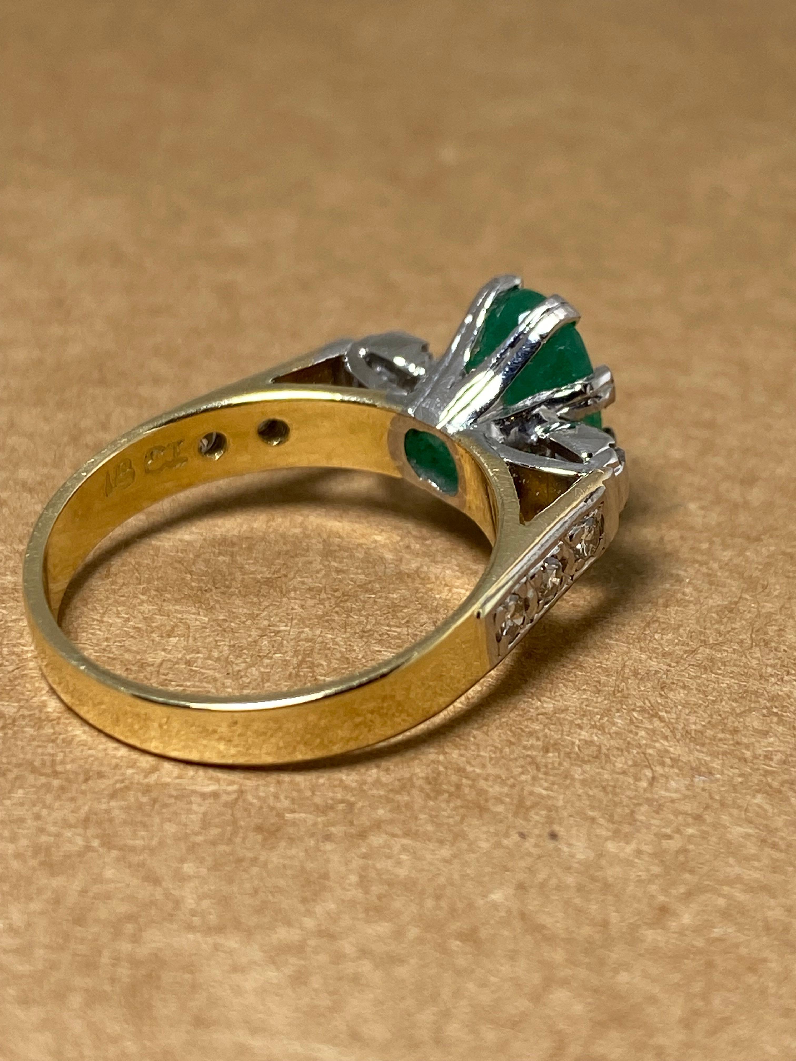 Of timeless solitaire with accents design,

featuring visually striking cathedral setting & 

top quality materials 

this piece is retro & handmade, 

dating back to 1960's 



~~



Centrally 8 double claw set with a Natural Emerald

of oval