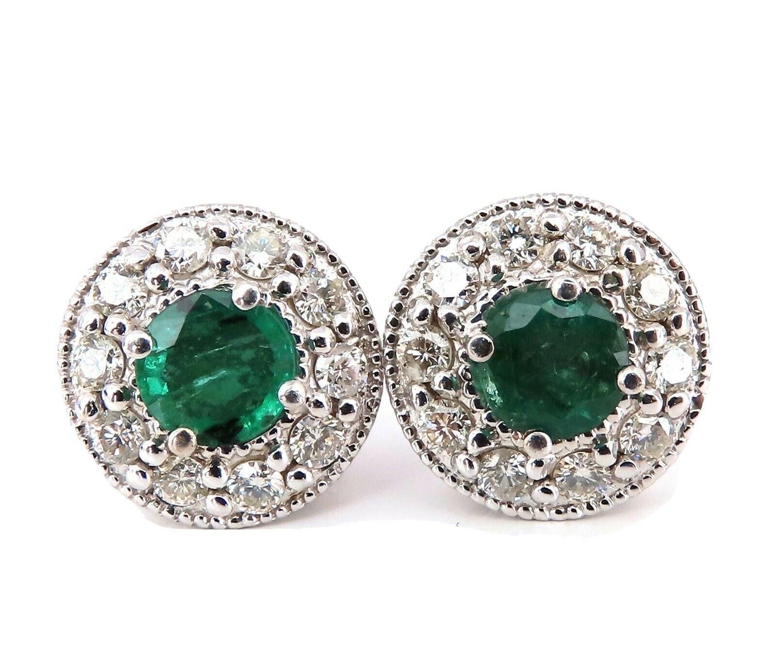 Round Halo cluster earrings.

1.30 carat natural round emeralds.

Full cut brilliant clean clarity and transparent

Emeralds measure 5.3 mm each in diameter

1.00 carat round diamonds

G color vs2 clarity

14 karat white gold 4.8 g

Diameter of