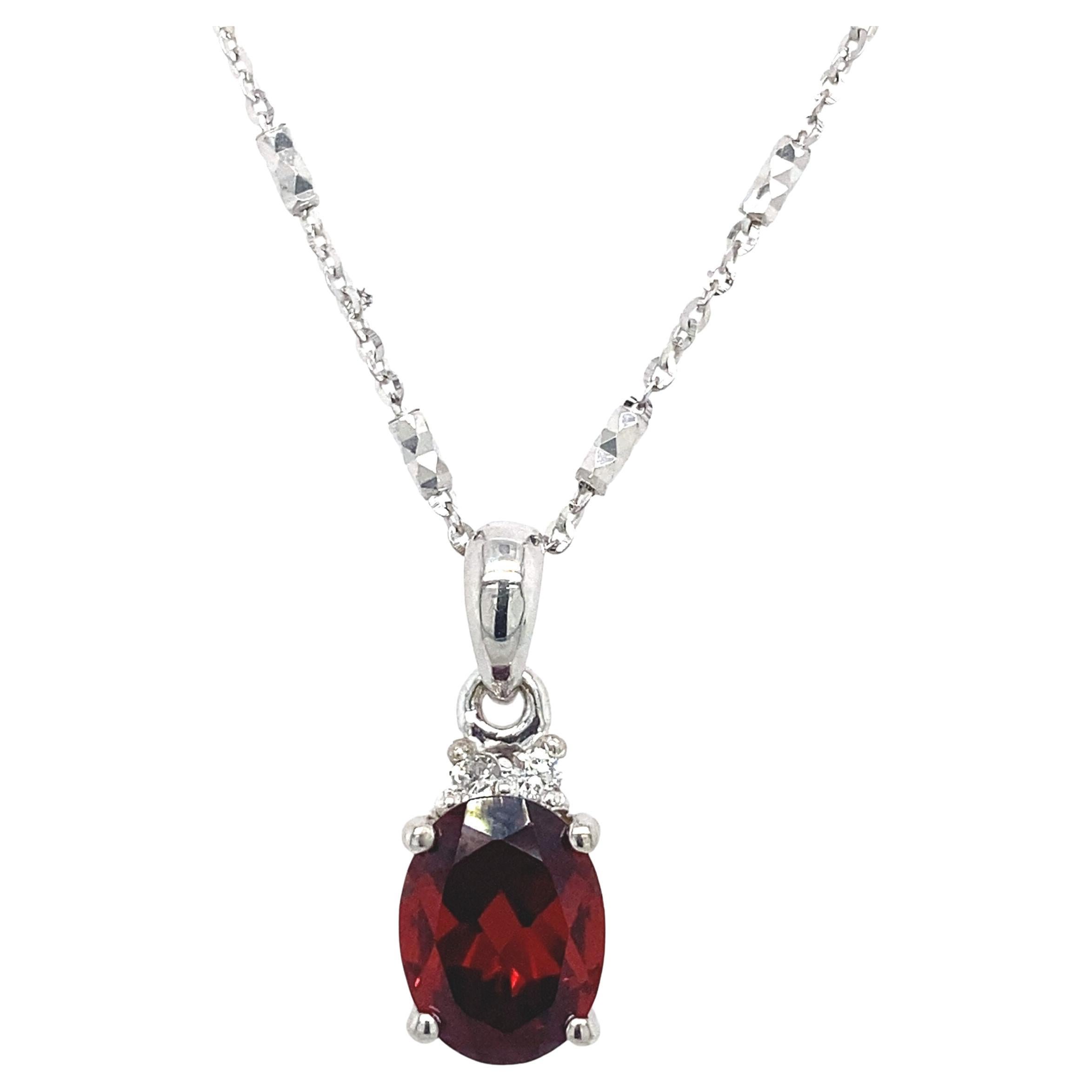 2.30ct Oval Garnet & 2 Round Diamond Pendant in 18ct White Gold