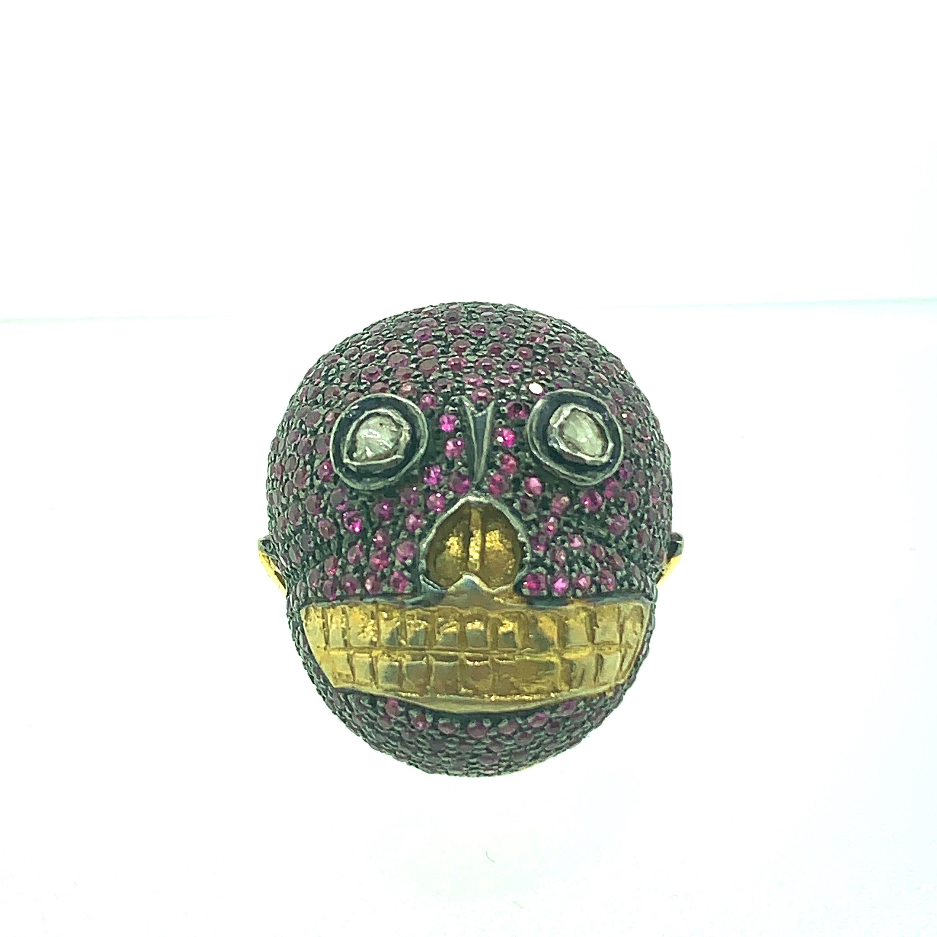 2.30ct Ruby , 0.09ct Diamonds Skull Ring in Oxidized Sterling Silver , 14K Gold. The shank is made of 14K Gold. The face is sterling silver with Rubies set all over and the teeth and nose are 14K Gold. The eyes are Old mine cut diamonds.
Stones :