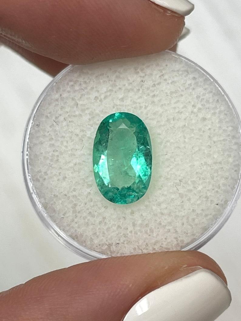 Stone: Emerald
Weight: 2.31-carats
Shape: Oval Cut
Clarity: Transparent
Luster: Very Good
Color: Green
Measurements: 11.69mm x 7.58mm x 4.33mm
Geographic Origin: Colombia
Treatment: Natural, Oiling

Comments: Due to their growth conditions in nature