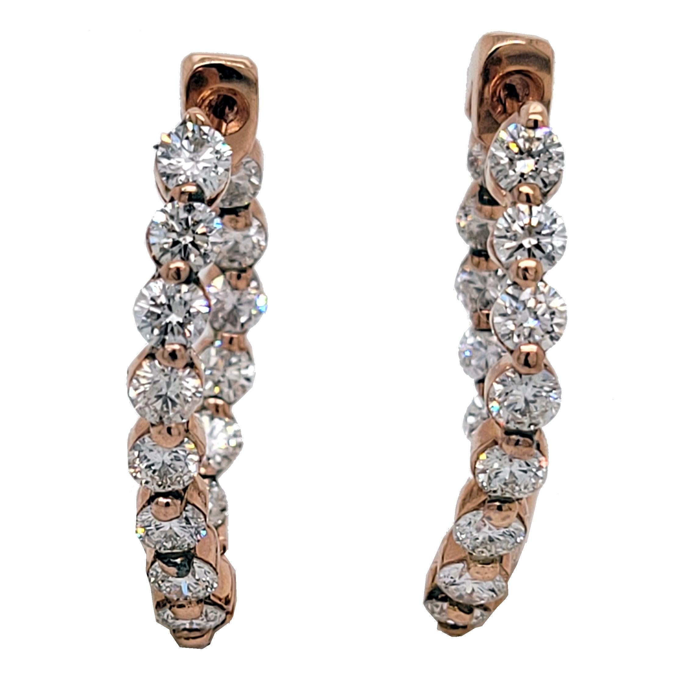 This beautiful 14K Rose Gold Inside/Outside hoop earrings has 28 2.8mm round brilliant diamonds with total weight of 2.39 Ct set in Shared Prong style for maximum brilliance. The earring is 1 inch Long. The Earrings are designed with curvature to
