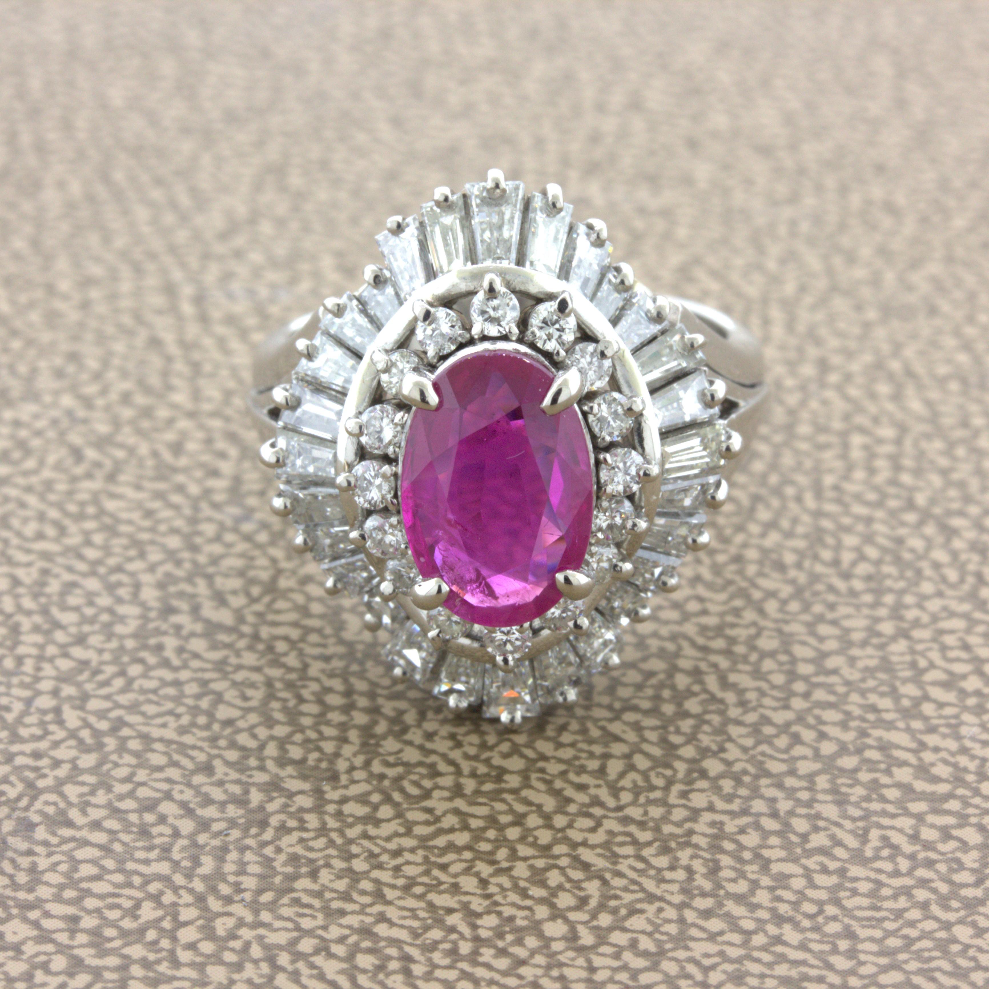 A beautiful and rare unheated oval-shape Burmese ruby takes center stage of this diamond platinum ballerina ring. The ruby weighs 2.31 carats and comes from the famous mines of Mogok in Burma. Burmese rubies are famed for their strong and vibrant