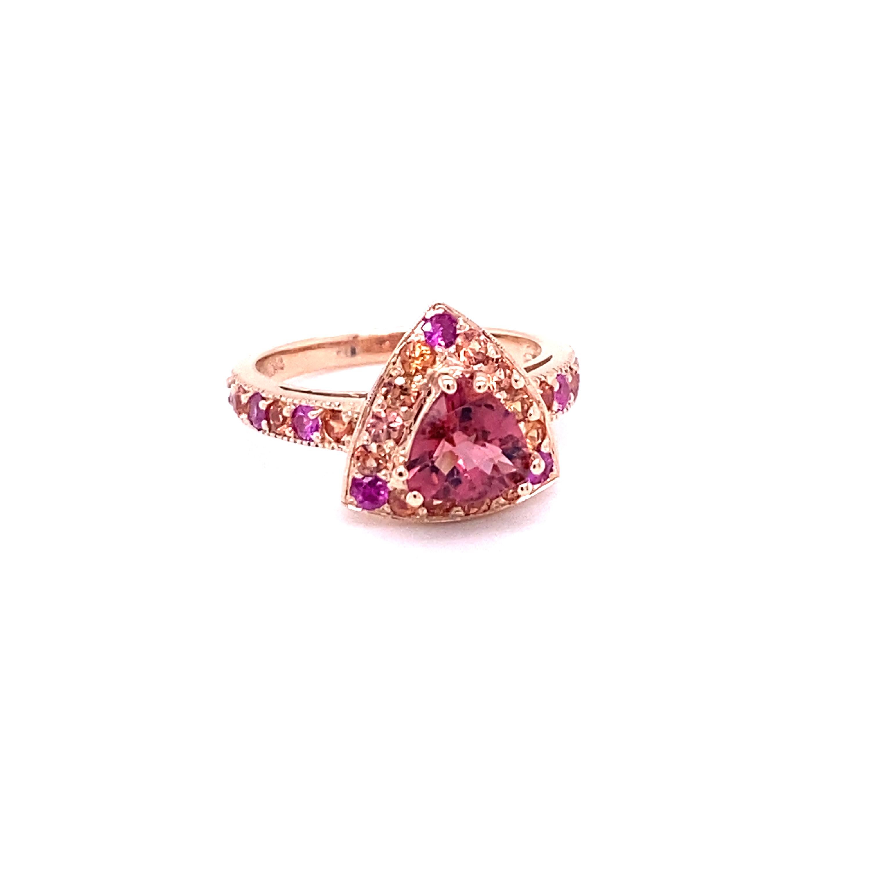 2.31 Carat Tourmaline Sapphire 14 Karat Rose Gold Cocktail Ring

This Ring has a Trillion Cut Tourmaline that weighs 1.20 Carats and is surrounded by 27 Multi Sapphires that weigh 1.11 Carats. The Total Carat weight of this Ring is 2.31 Carats.