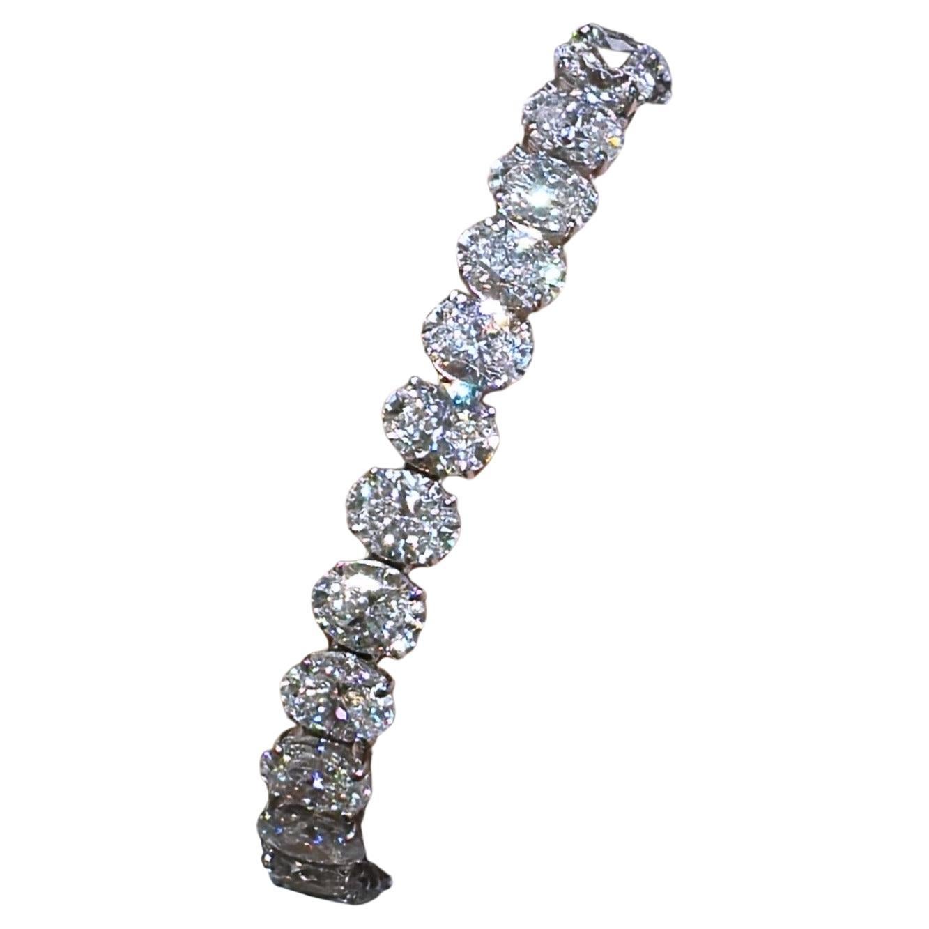 Daniella Design SKU: 127778
Oval cut diamond riviera line tennis bracelet is absolutely amazingly crafted in luxurious Platinum and made with 33 oval-cut diamonds of each GIA-certified stone 23.19carats! True fit for a queen. Everyone will gasp with