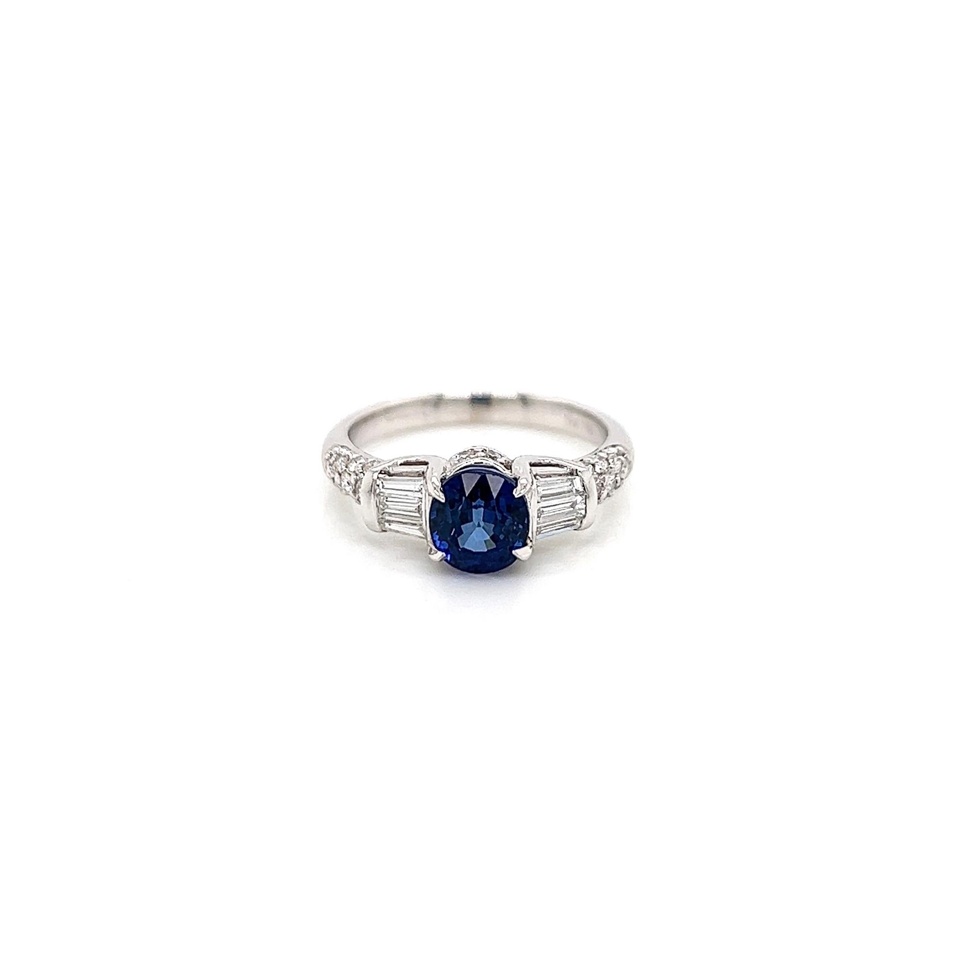 2.31 Total Carat Sapphire Diamond Engagement Ring

-Metal Type: 18K White Gold
-1.79 Carat Oval Cut Blue Sapphire
-0.28 Carat Baguette Side Natural Diamonds
-0.24 Carat Round Side Natural Diamonds
-Size 6.75

Made in New York City.