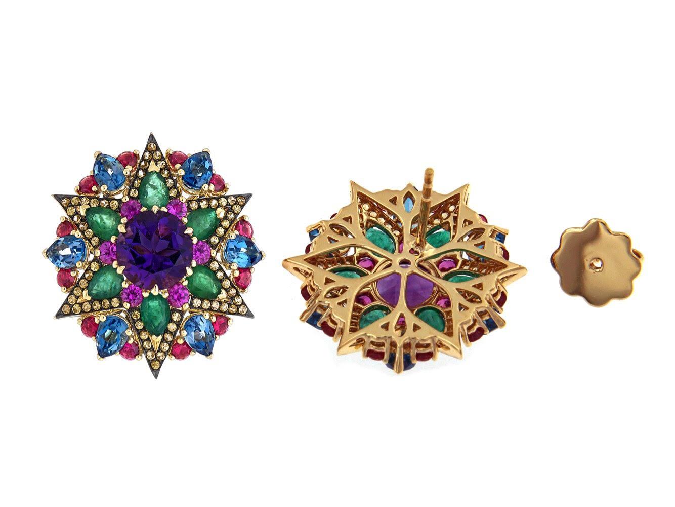 Fun and vibrant, these multicoloured studs are a kaleidoscope of colours set in 18k yellow gold. The 2.32 carats amethyst centre stones are decorated with a combination of coloured sapphires, emeralds and topaz. These can be dressed down or up.


