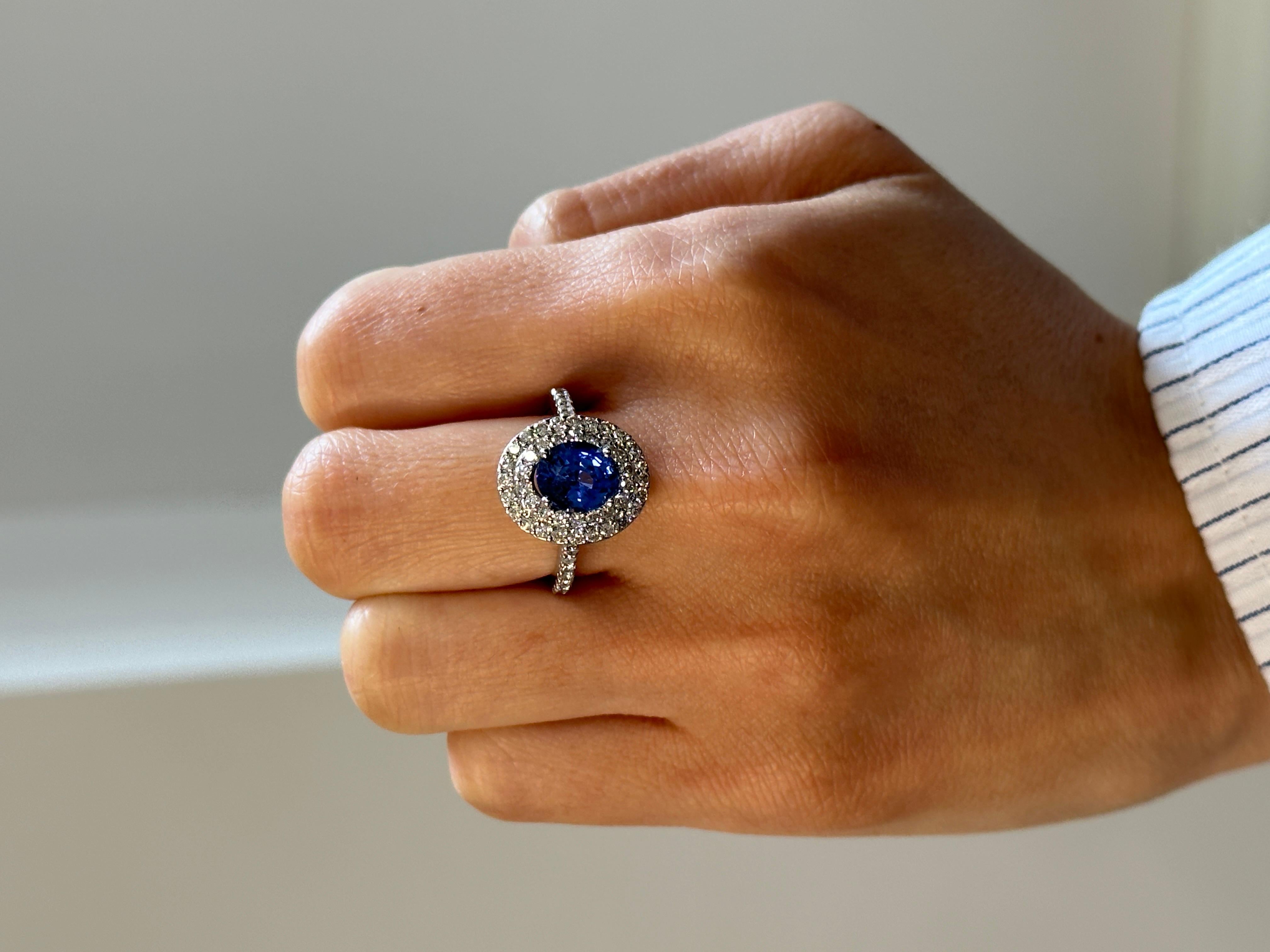 Contemporary 2.32 Carat Blue Sapphire and 0.9 Carat Total Weight Diamond Ring in White Gold For Sale