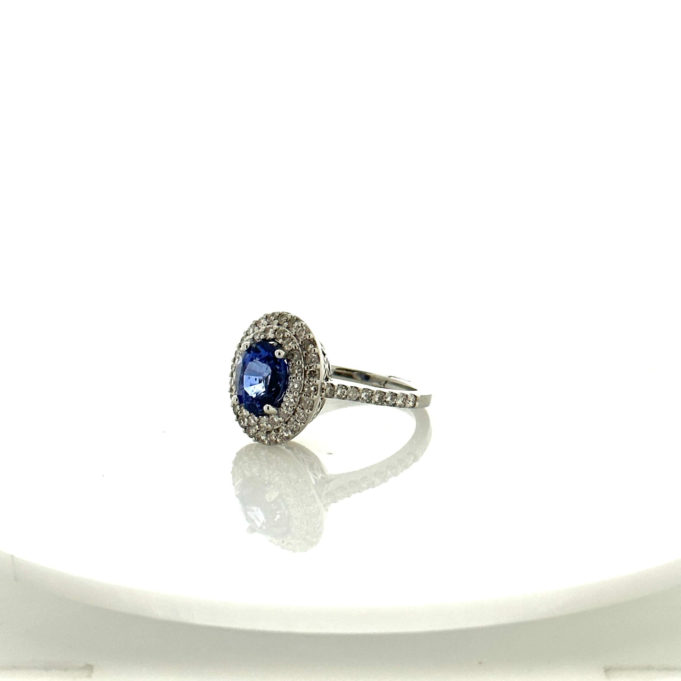 Cushion Cut 2.32 Carat Blue Sapphire and 0.9 Carat Total Weight Diamond Ring in White Gold For Sale