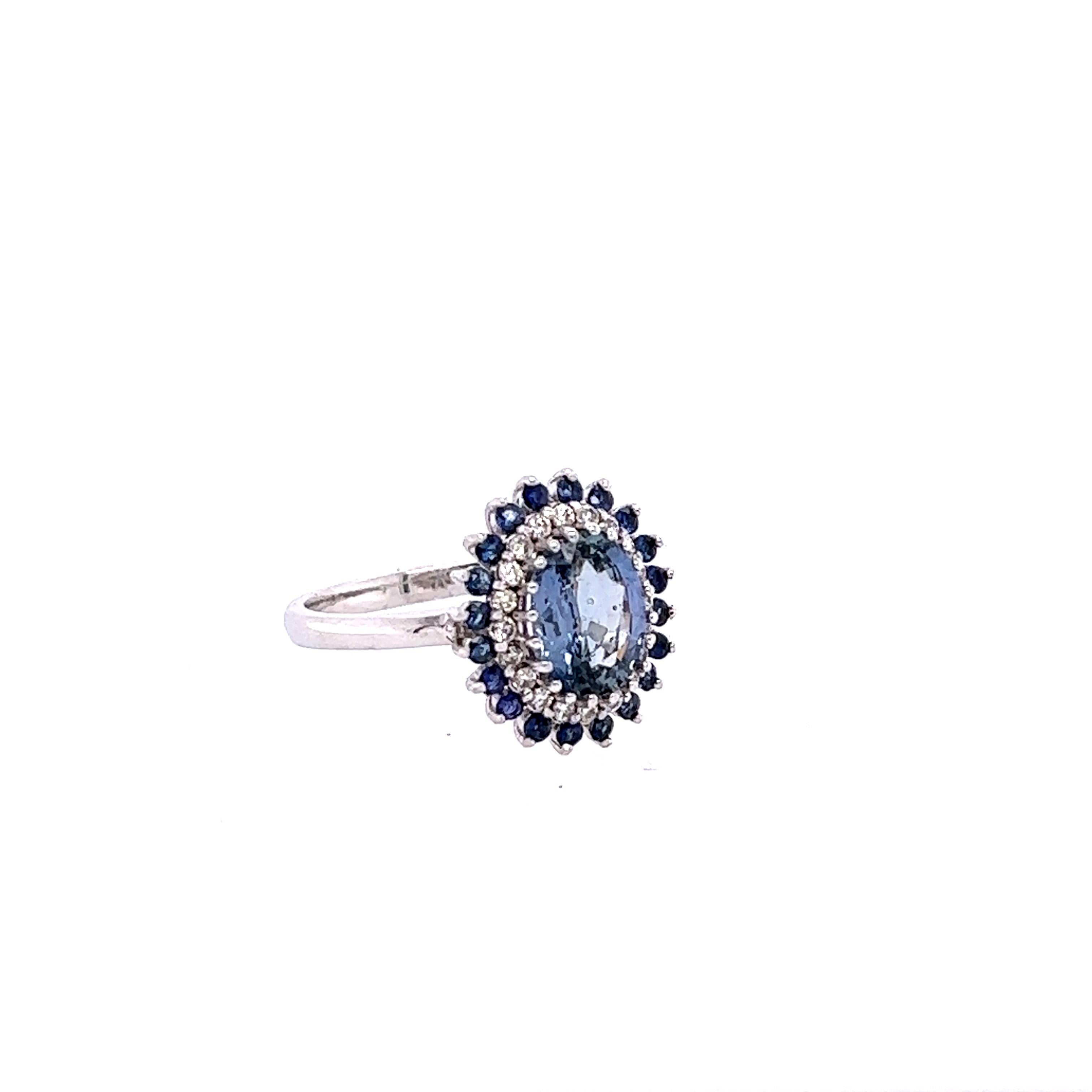 This ring has a Natural Oval Cut GIA Certified Blue Sapphire that weighs 1.75 carats. 
The GIA Certificate # is: 2223314194. The Blue Sapphire is natural and has no indications of heating. It is surrounded by 20 Blue Natural Round Cut Sapphires that