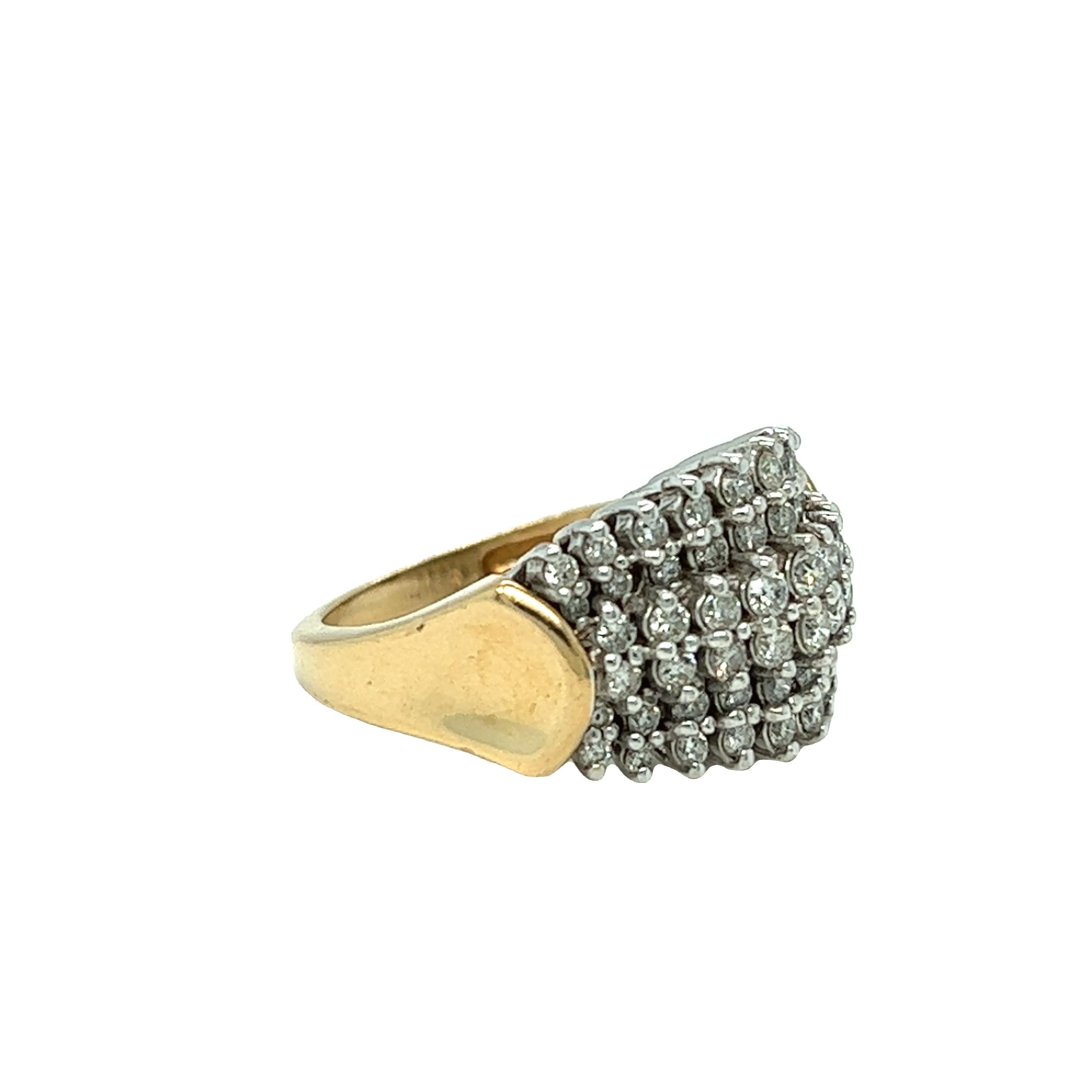 From our estate collection, this pyramid cluster diamond ring features six rows of round brilliant cut diamonds weighing approximate 2.32 carats. The ring is crafted in 14k yellow gold and the top of the ring in white gold. The beautiful two tone
