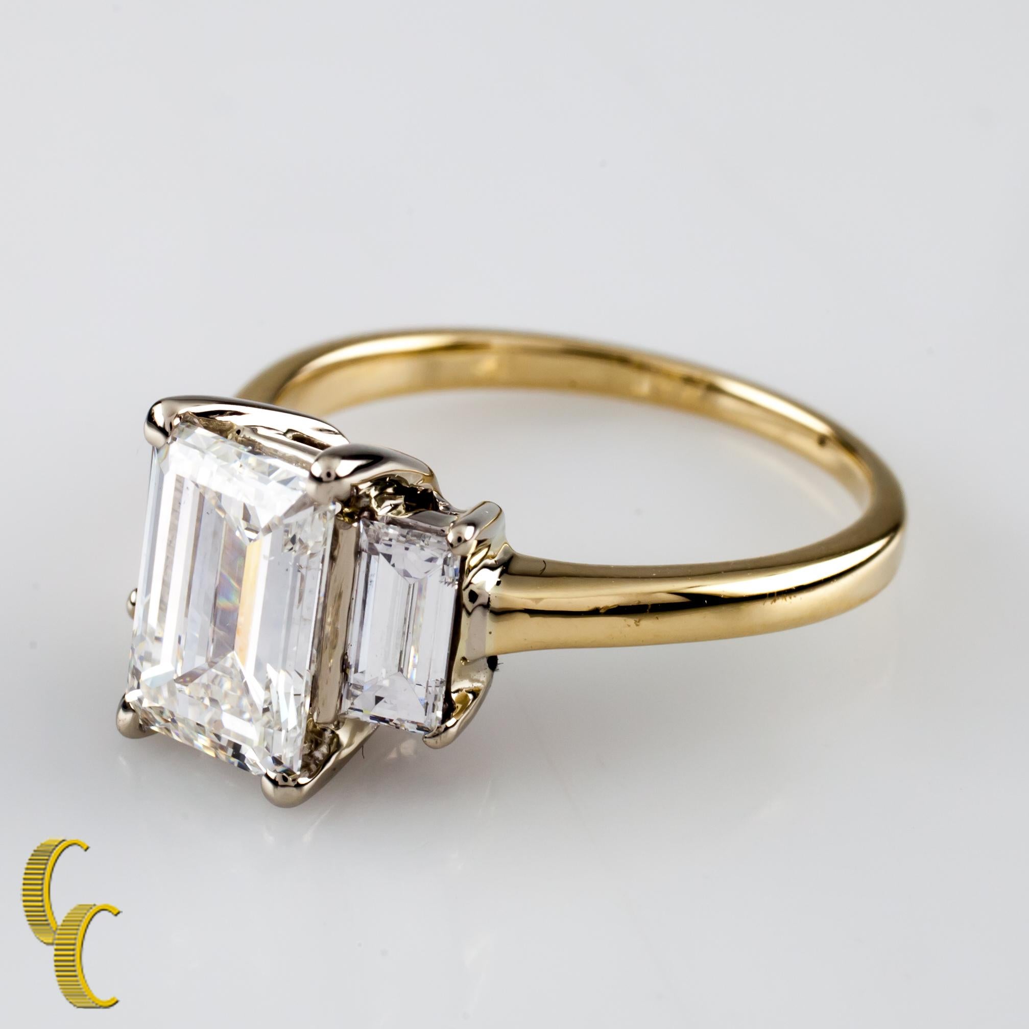 Gorgeous Three-Stone 14k Yellow Gold Engagement Ring
Center Stone: 
Cut: Emerald Cut
Color Grade: G
Clarity: SI-1
Carat Weight: 1.52 carats
Two .40 ct / G Color / VS1 - VS2 Emerald Cut Accent Stones (Total Diamond Weight of all Stones = 2.32