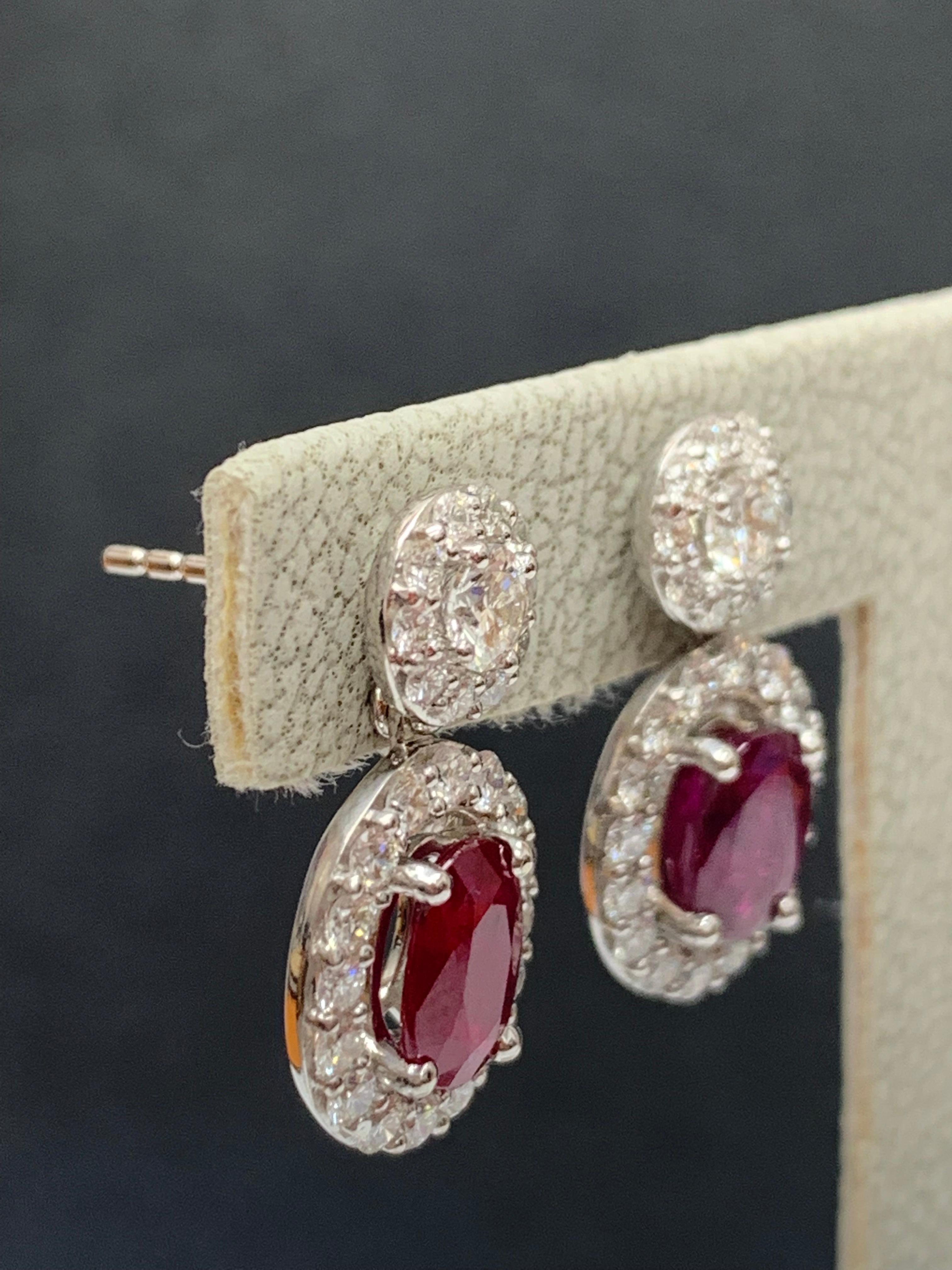 Contemporary 2.32 Carat of Oval cut Rubies and Diamond Drop Earrings in 18K White Gold For Sale