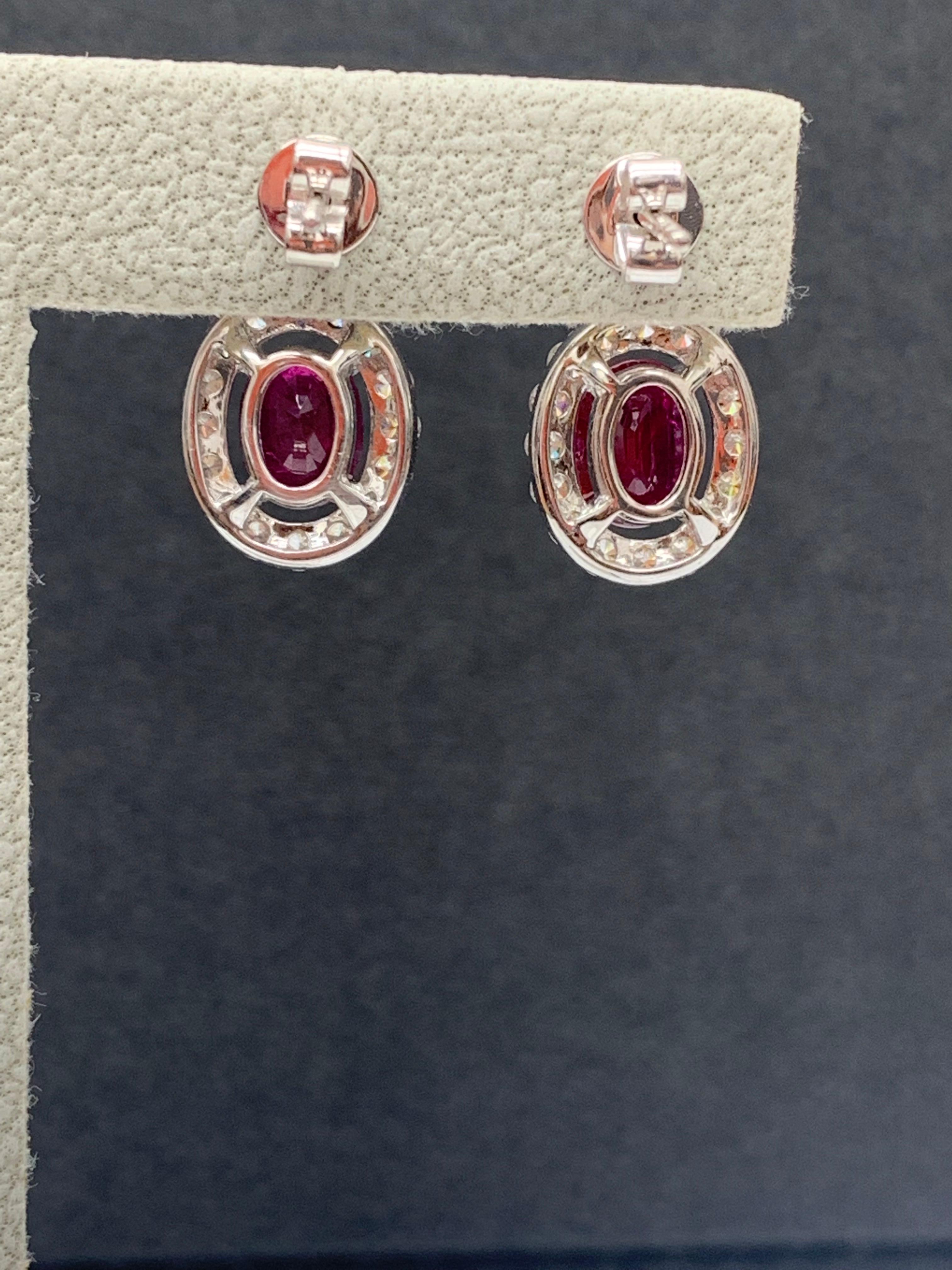 Women's 2.32 Carat of Oval cut Rubies and Diamond Drop Earrings in 18K White Gold For Sale