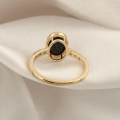 2.32 Carat Oval Blue Sapphire 0.21 Carat SI/H Diamond Ring 14 Karat Yellow Gold