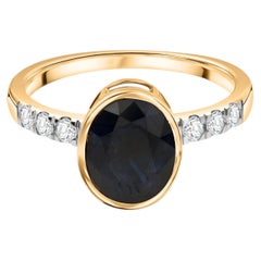 2.32 Carat Oval Blue Sapphire 0.21 Carat SI/H Diamond Ring 14 Karat Yellow Gold