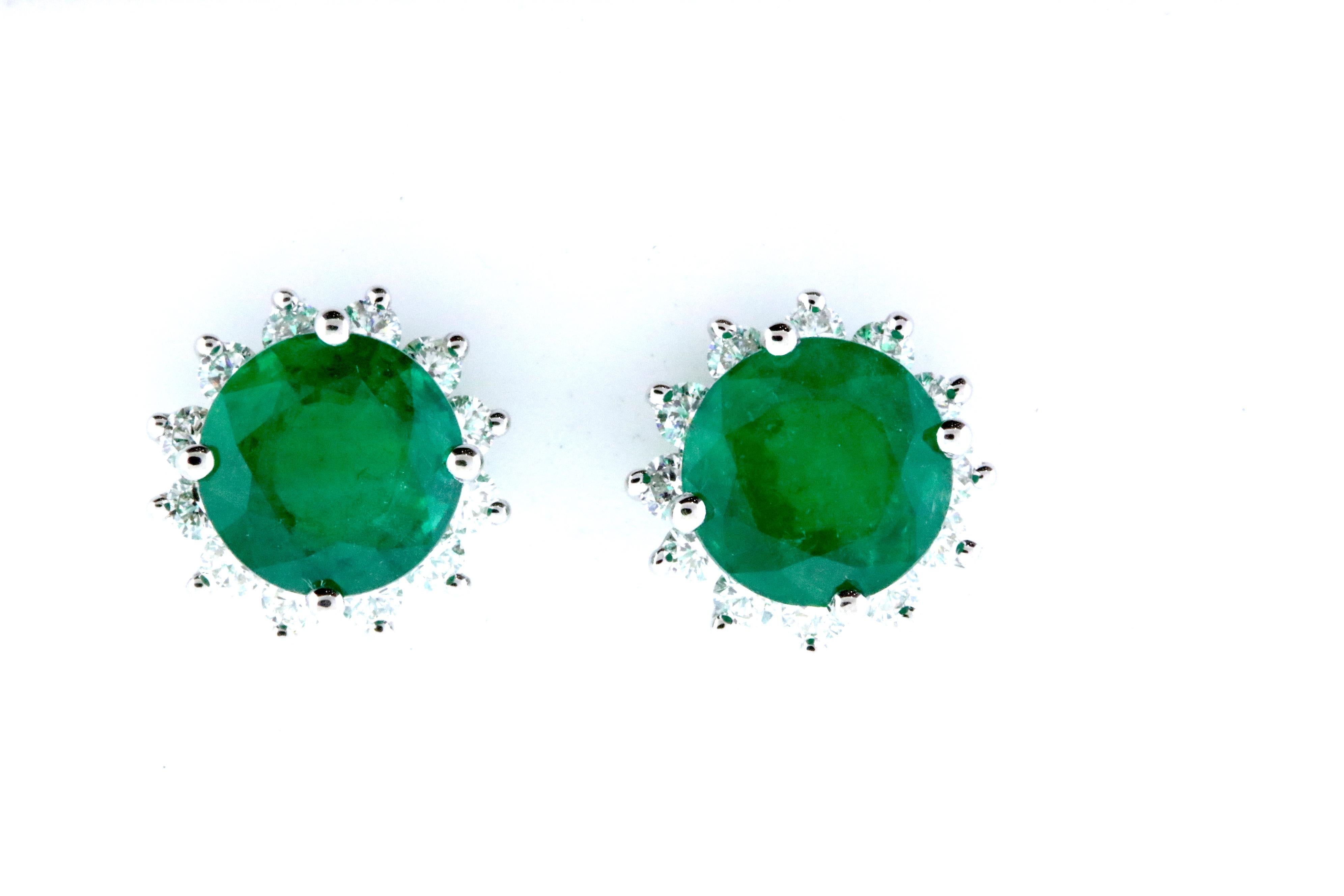 It doesn't get more elegant than round cut Emeralds with a halo of White Diamonds on the lobe! We were so excited to find a pair of Emeralds so perfectly matched in quality, color, and size, we just had to turn them into earrings!

Material: 14k