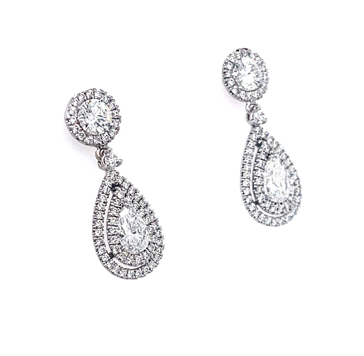 Diamond Round and Pear shape Dangle Earrings 18K White Gold

Pear shape weighs 0.40 carat E Color SI2 Clarity

With Stuller Certificate # 214444

Pear shape weighs 0.41 carat D Color SI2 Clarity

With GIA Certificate # 2151535002

Round Brilliant