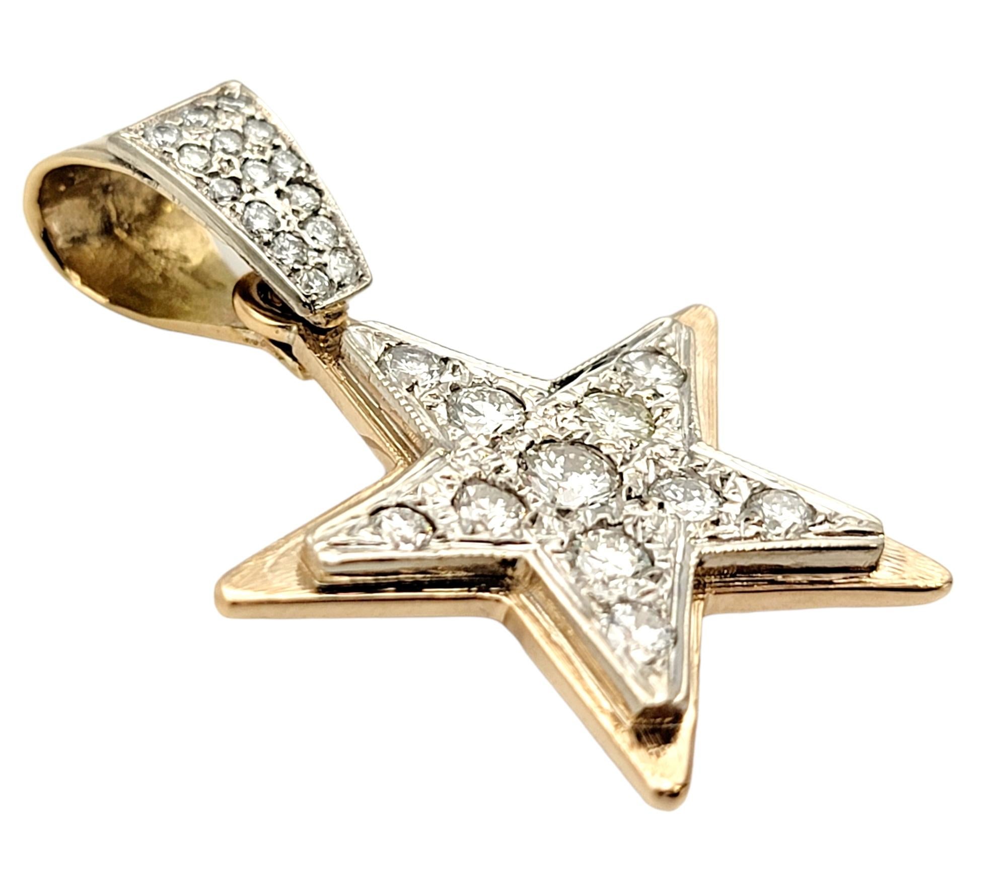 Bright and beautiful star pendant embellished with shimmering natural diamonds. The warm yellow gold setting adds a nice touch of contrast while the white gold really enhances the white brilliance of the diamonds. The perfect 5 point shape makes a