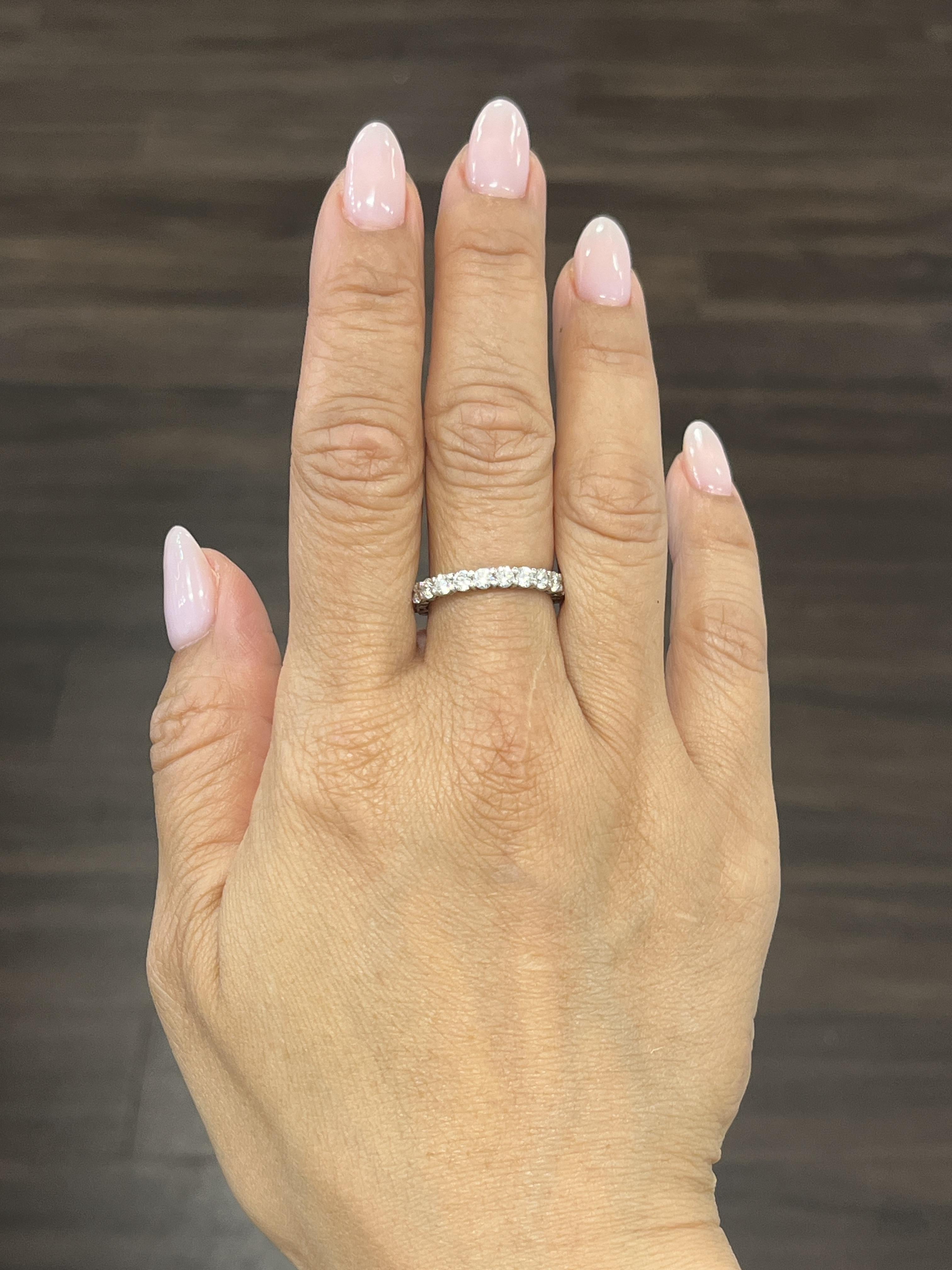 This gorgeous eternity ring features 23 round brilliant diamonds. The diamonds boast a color of G/H and VS2/SI1 in clarity. A stunning ring to add to any jeweler's collection.